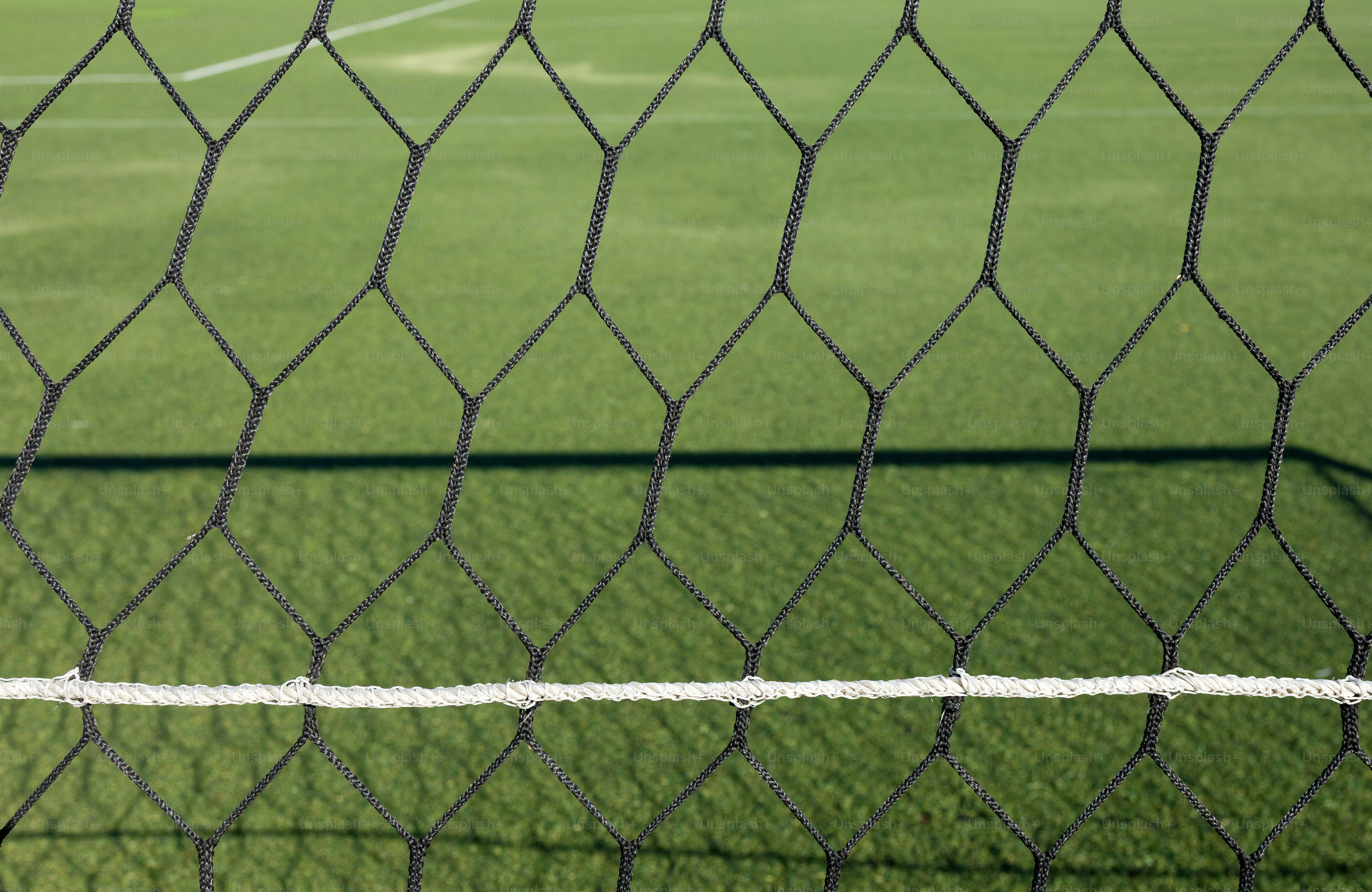 Soccer goal net and green artificial turf field. photo – Wallpaper ...