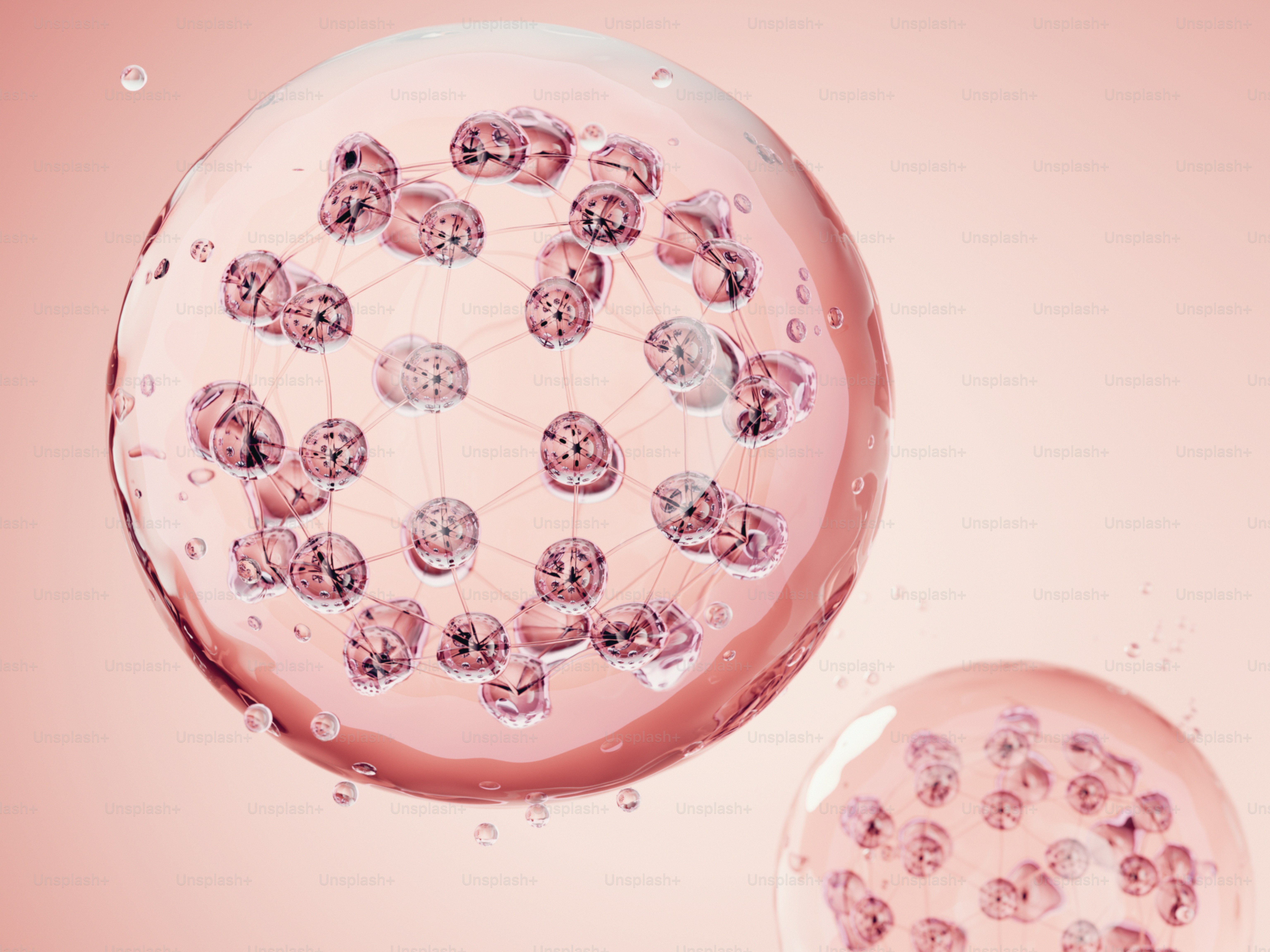 Translucent pink spheres with particles on a light pink background.