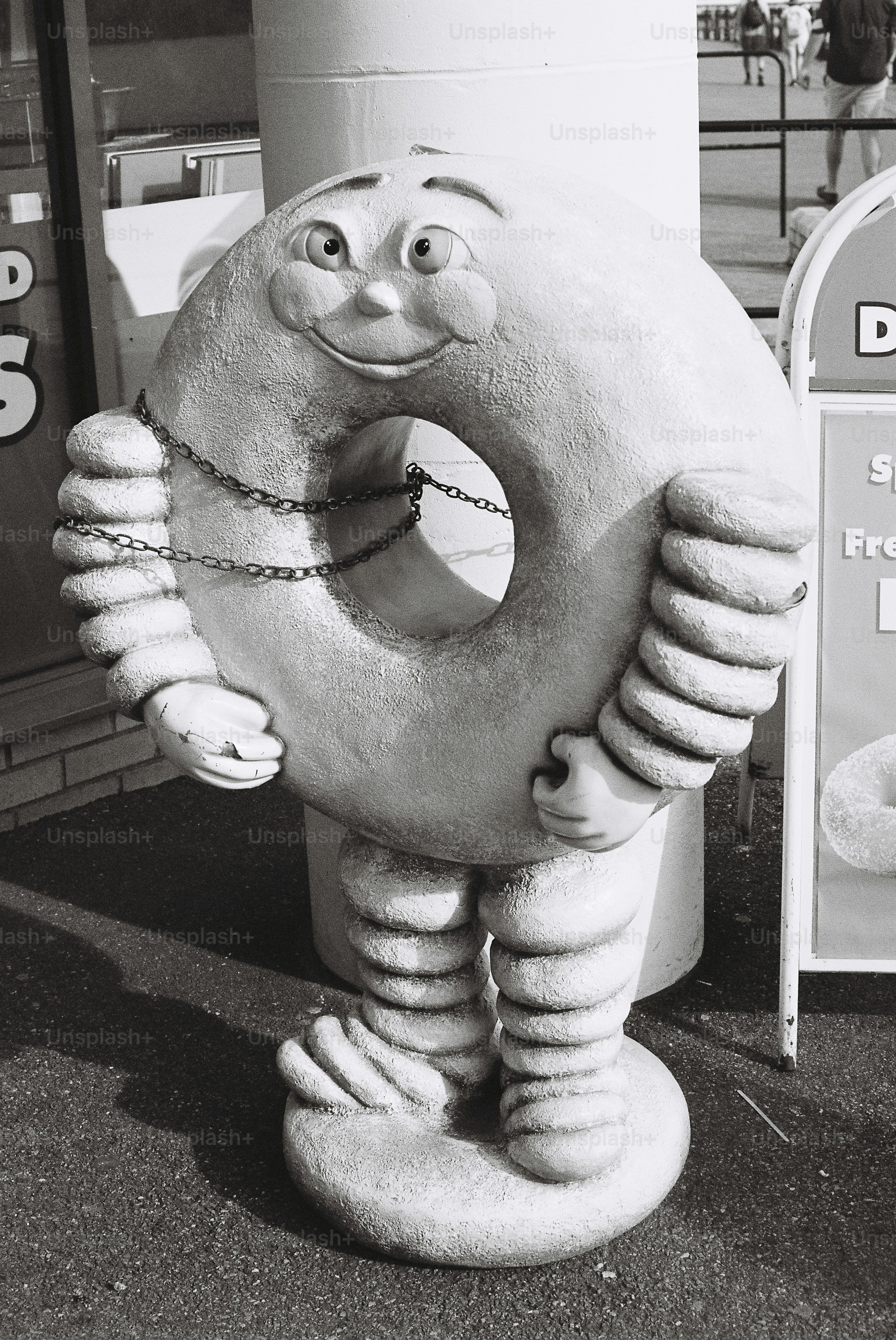 Black and white donut character statue.