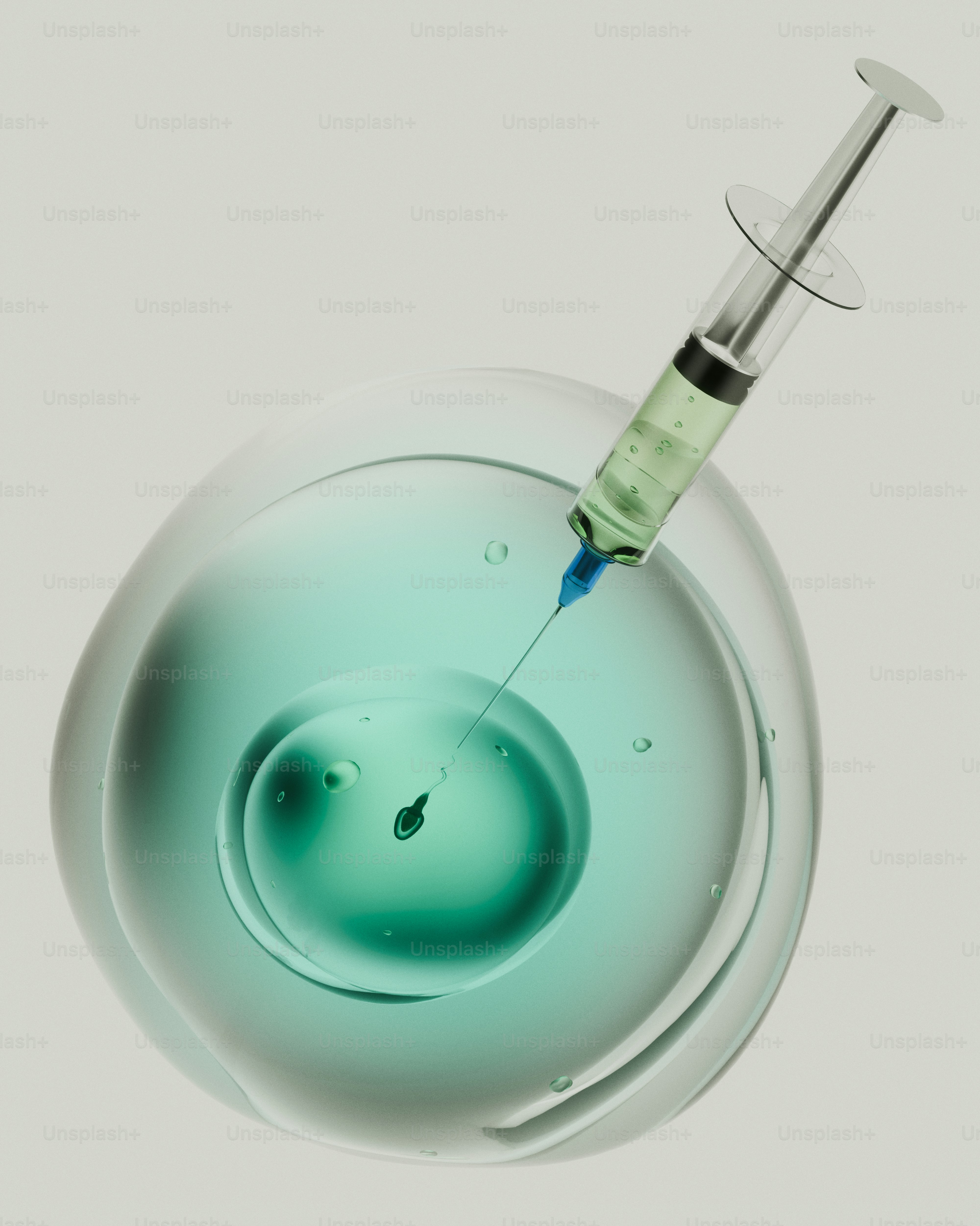Syringe injecting green liquid into a cell containing a sperm - Photo ...