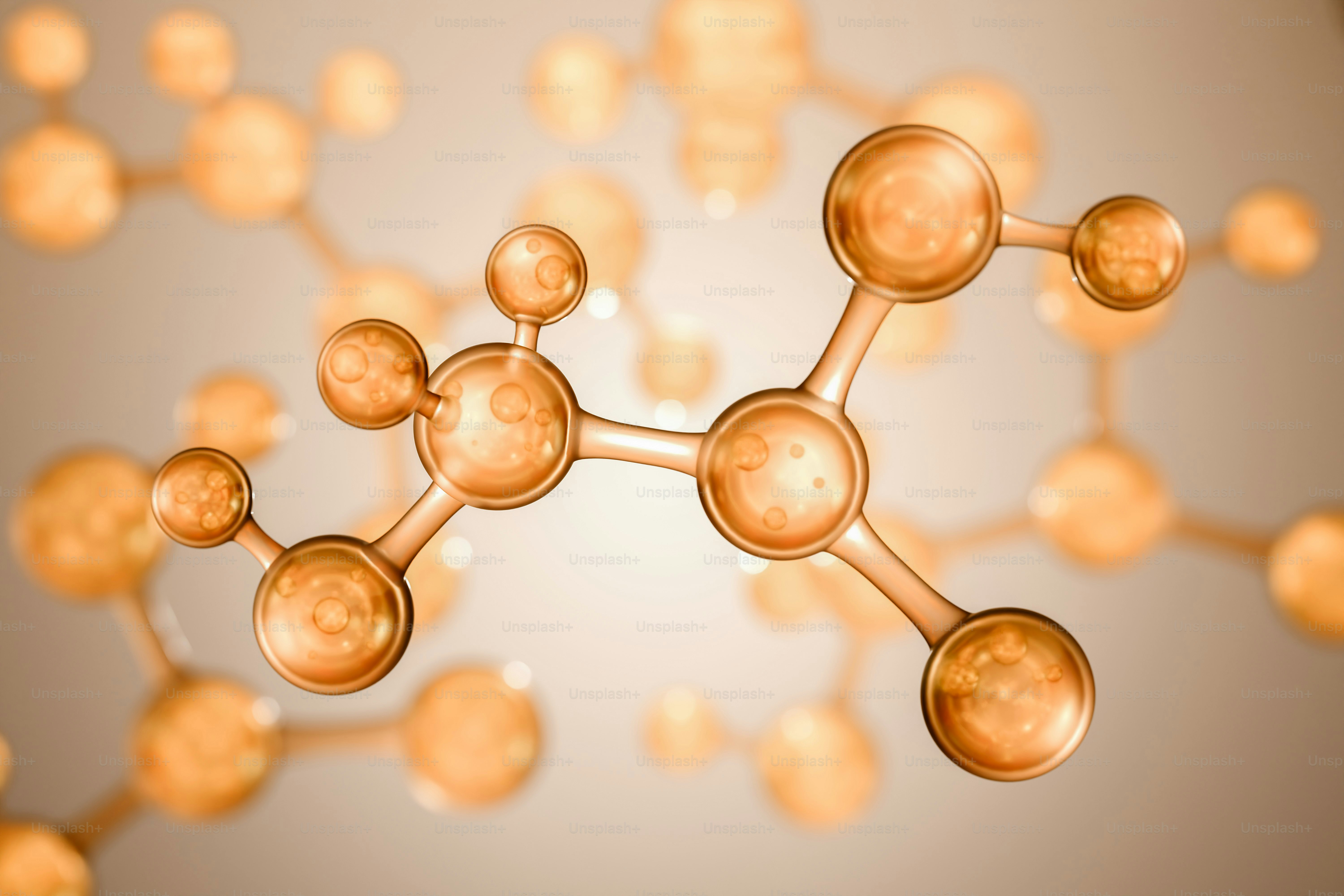 3D rendering of amber molecular structure with blurred background.