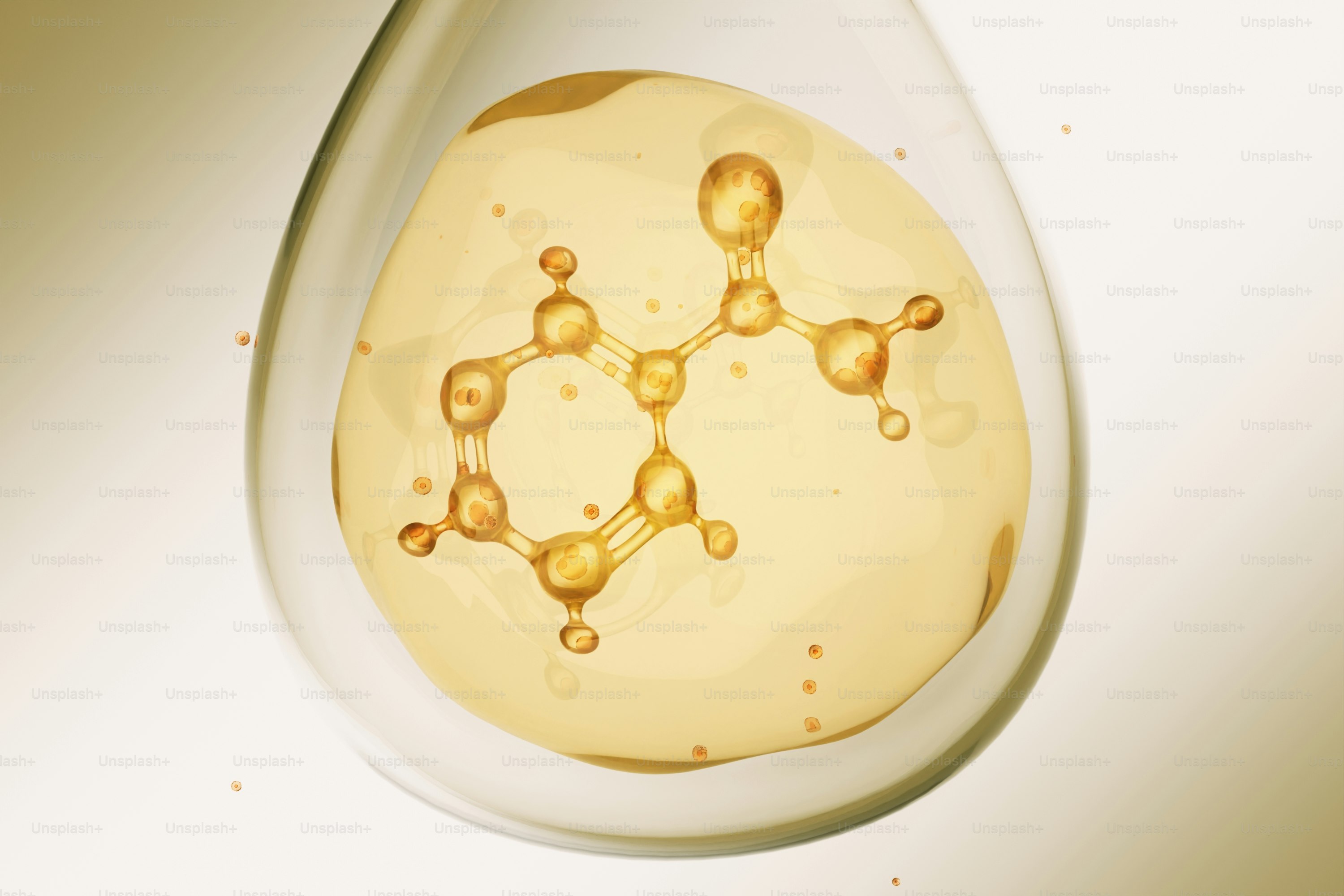 A golden chemical structure suspended within a liquid drop.