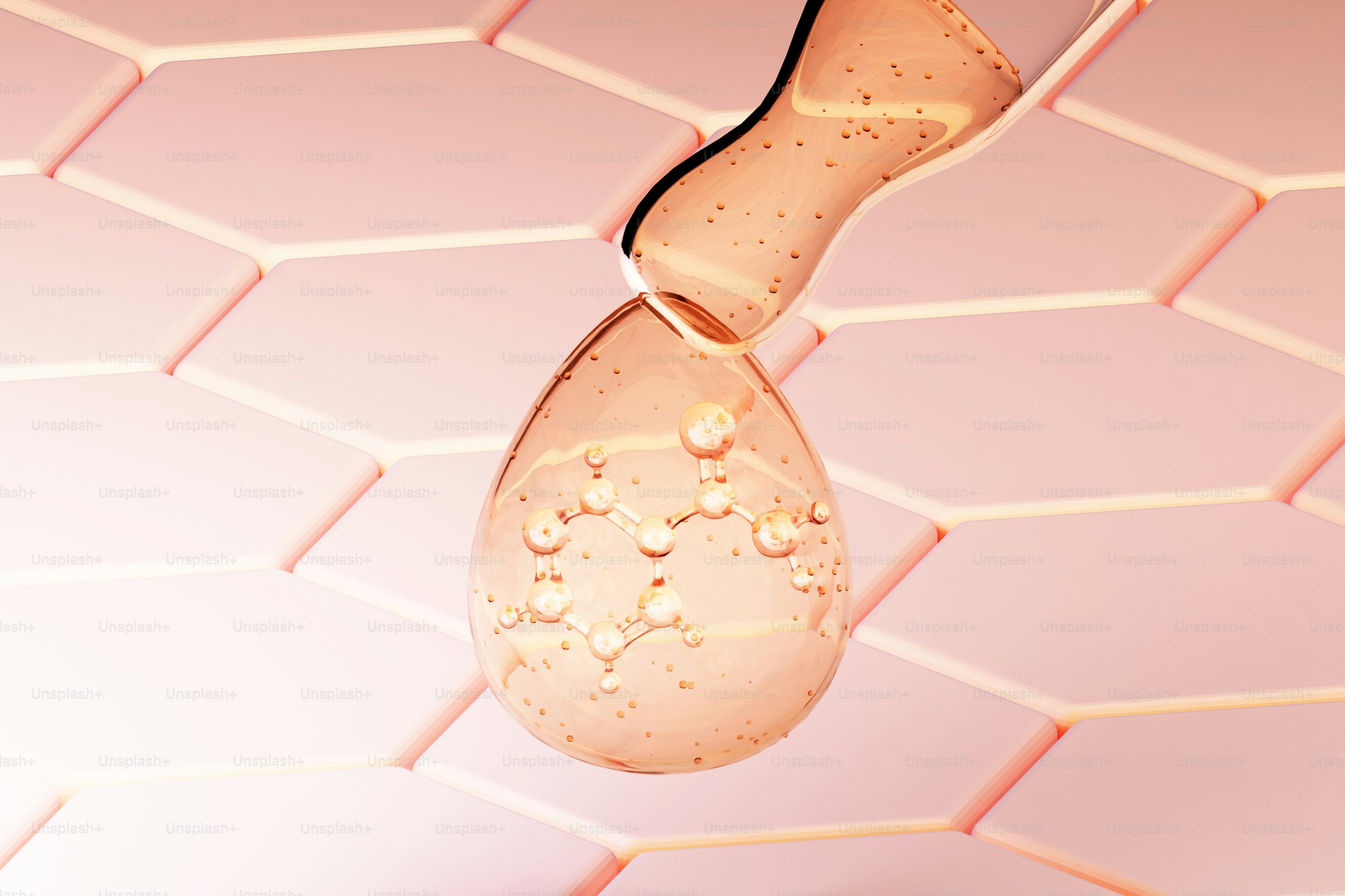 Amber liquid drop with bubbles on pink hexagonal background.