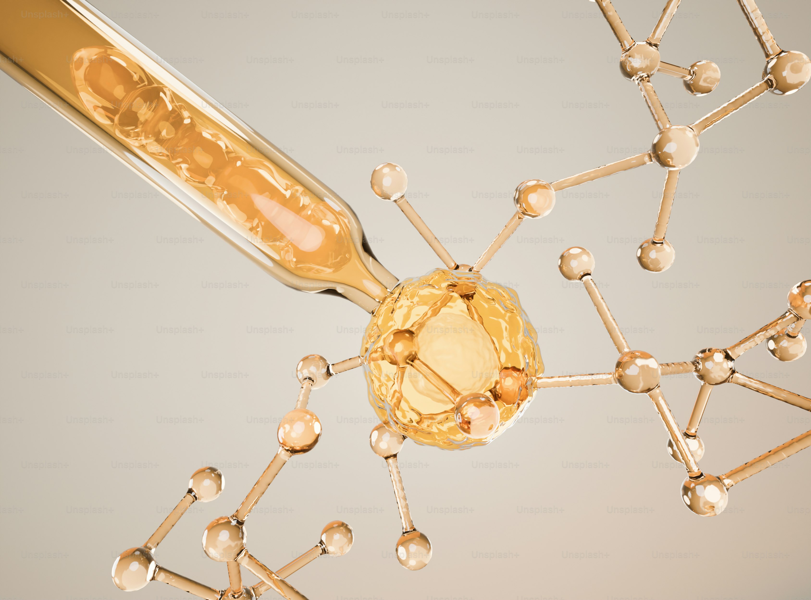 Contagocce che applica liquido dorato su una struttura molecolare.