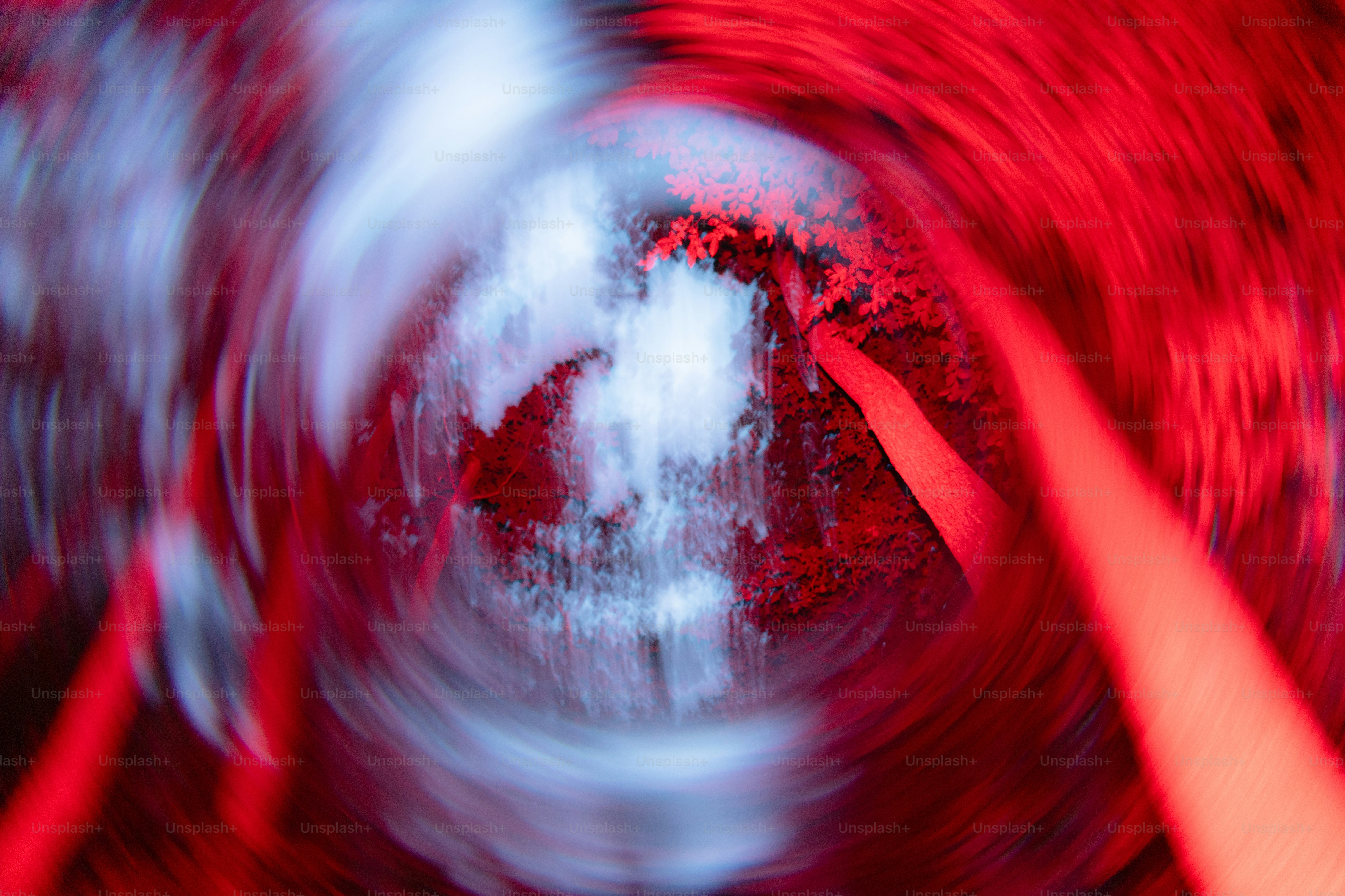 Blurred red and white abstract light vortex