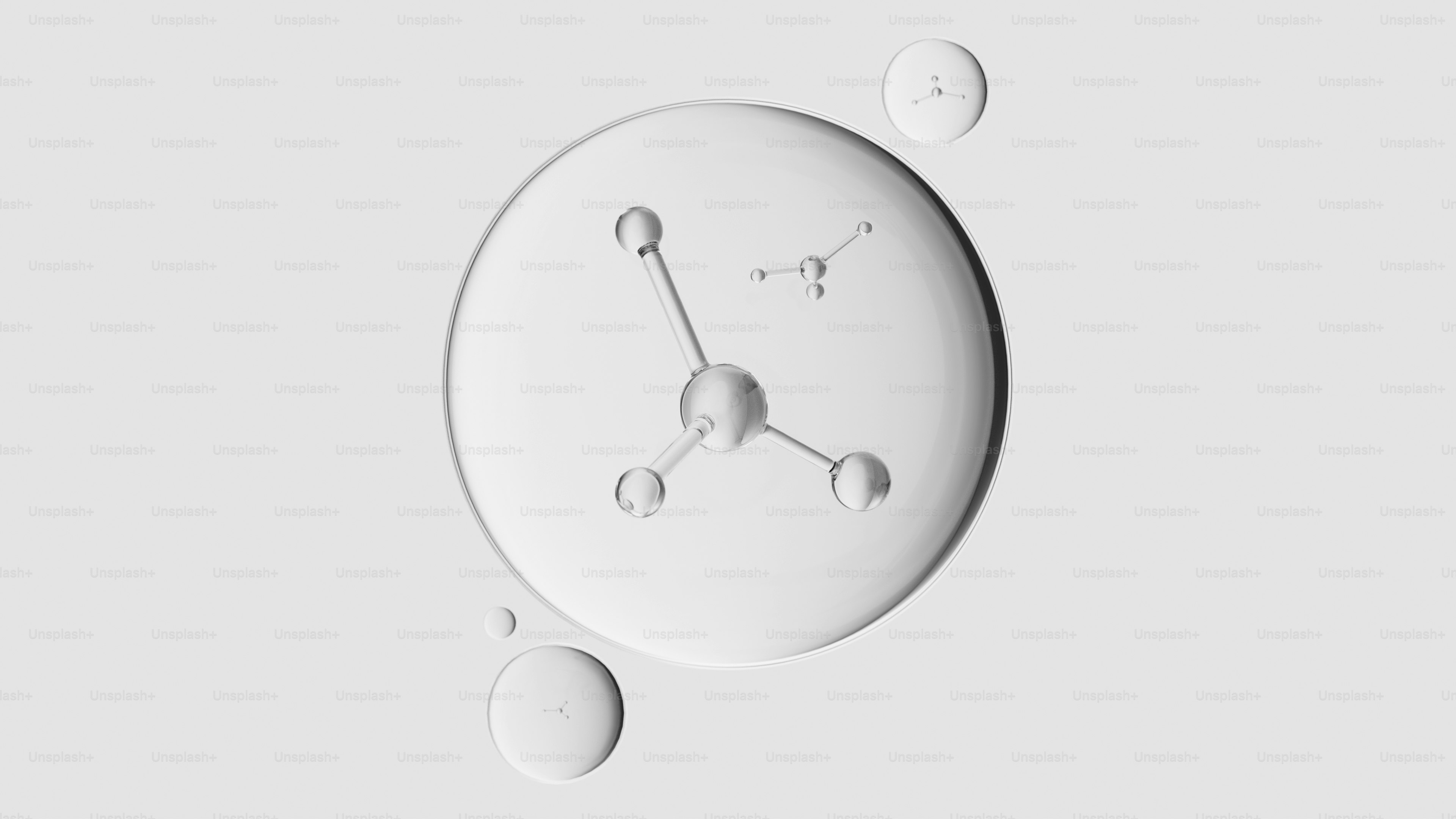 白い背景に分子構造のある透明な滴。