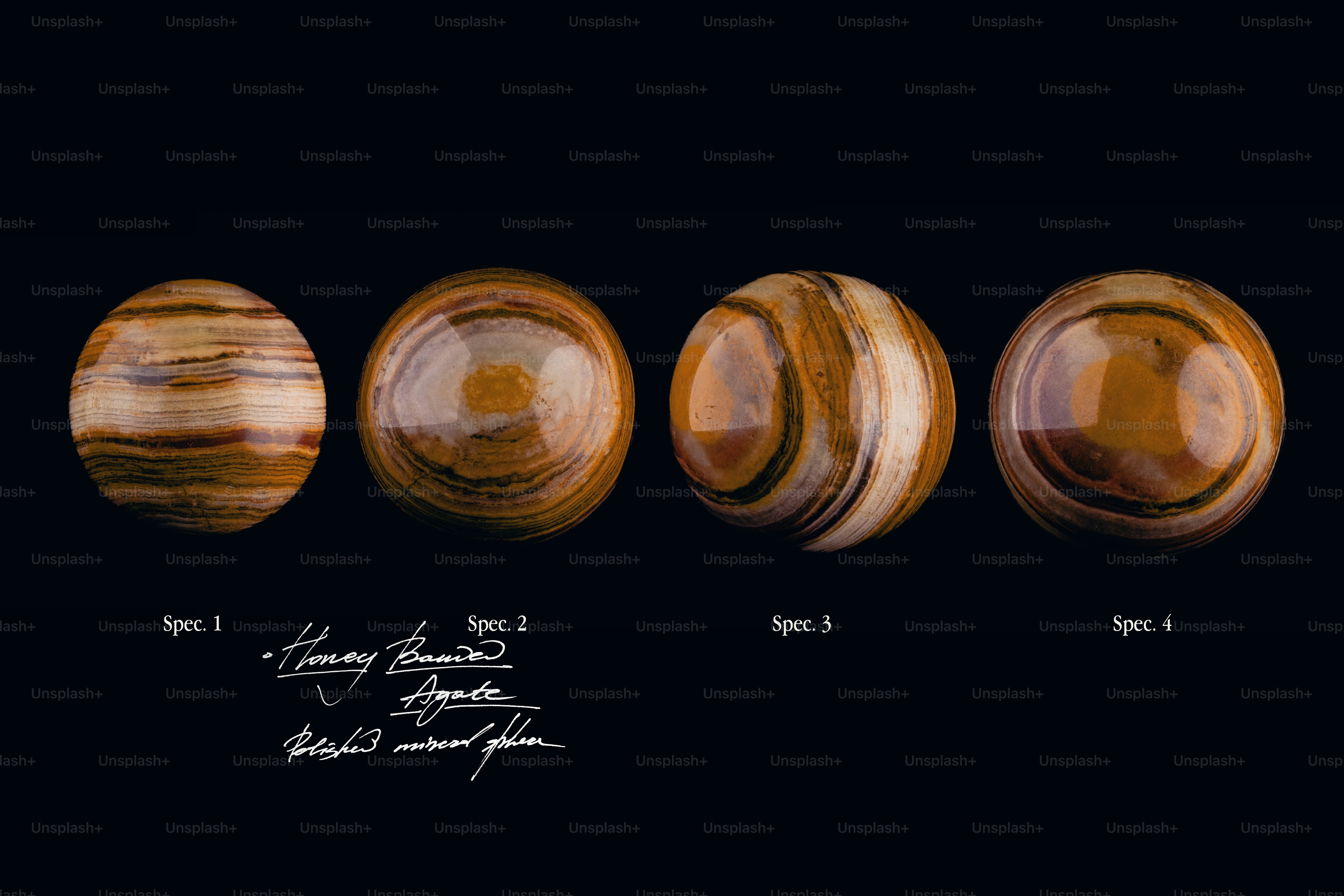Four spheres with unique brown and beige swirling patterns.