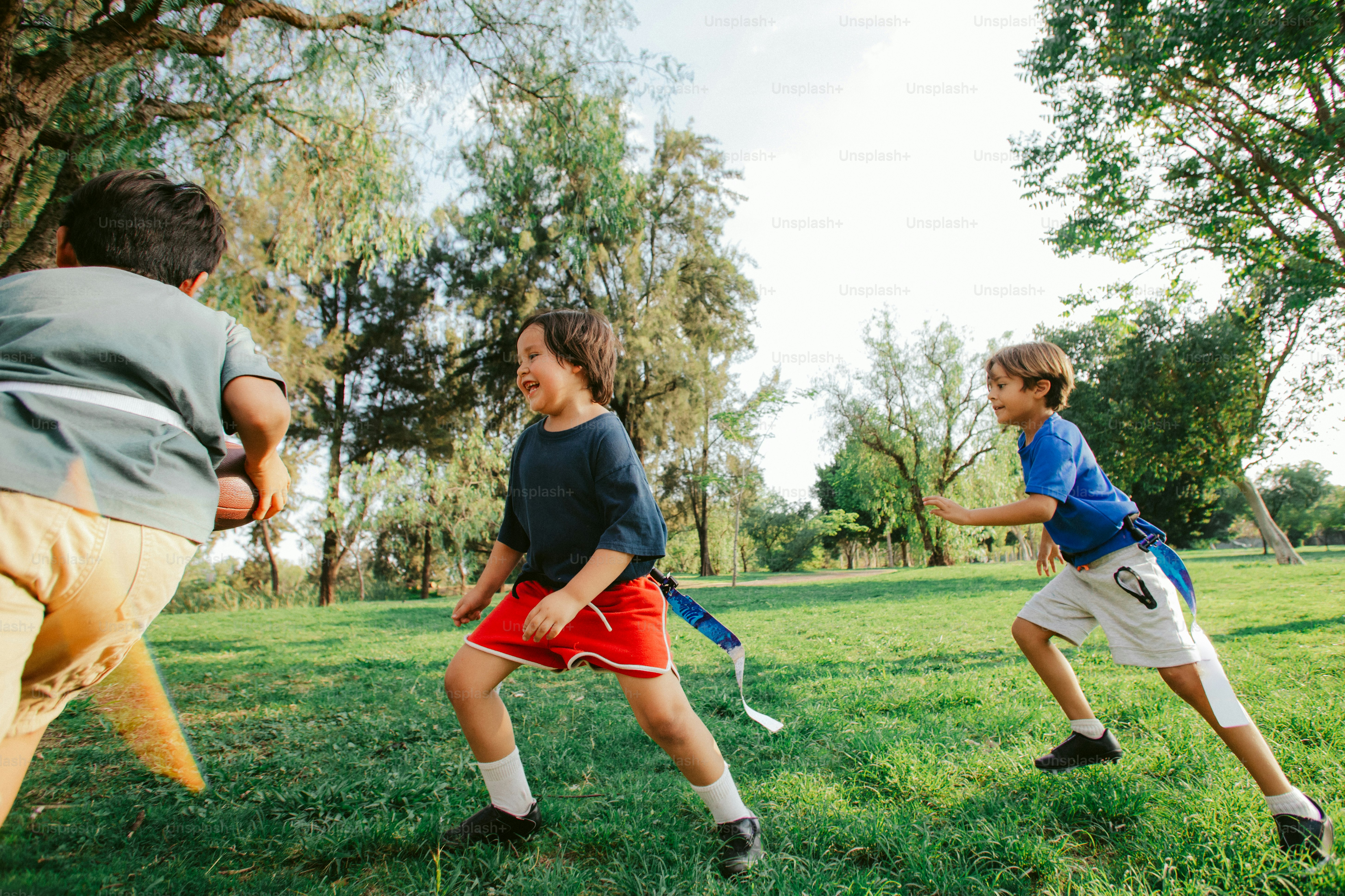 Young boys playing a game with sticks outdoors