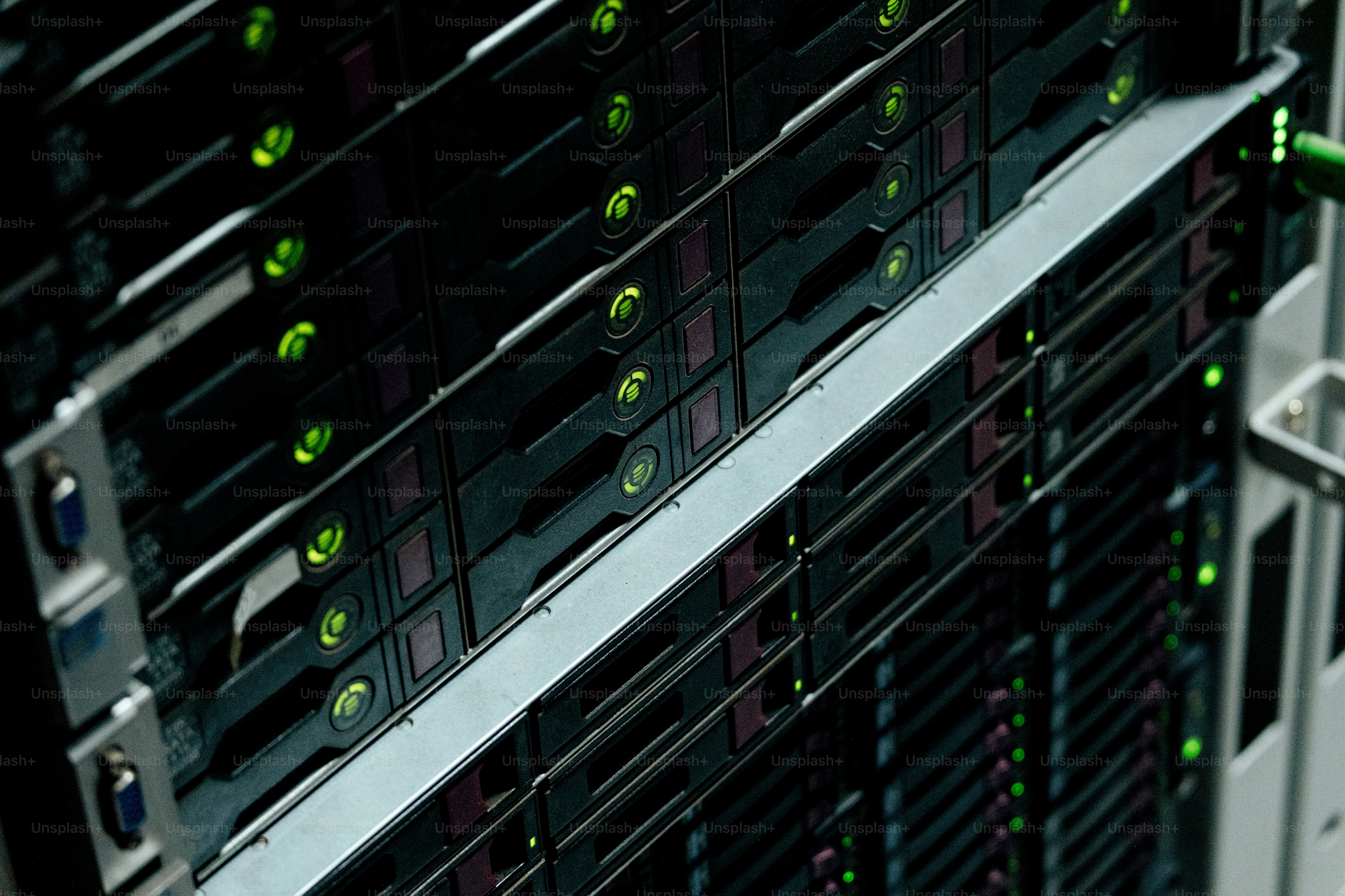 Data center server racks with green indicator lights - Photo on Unsplash+