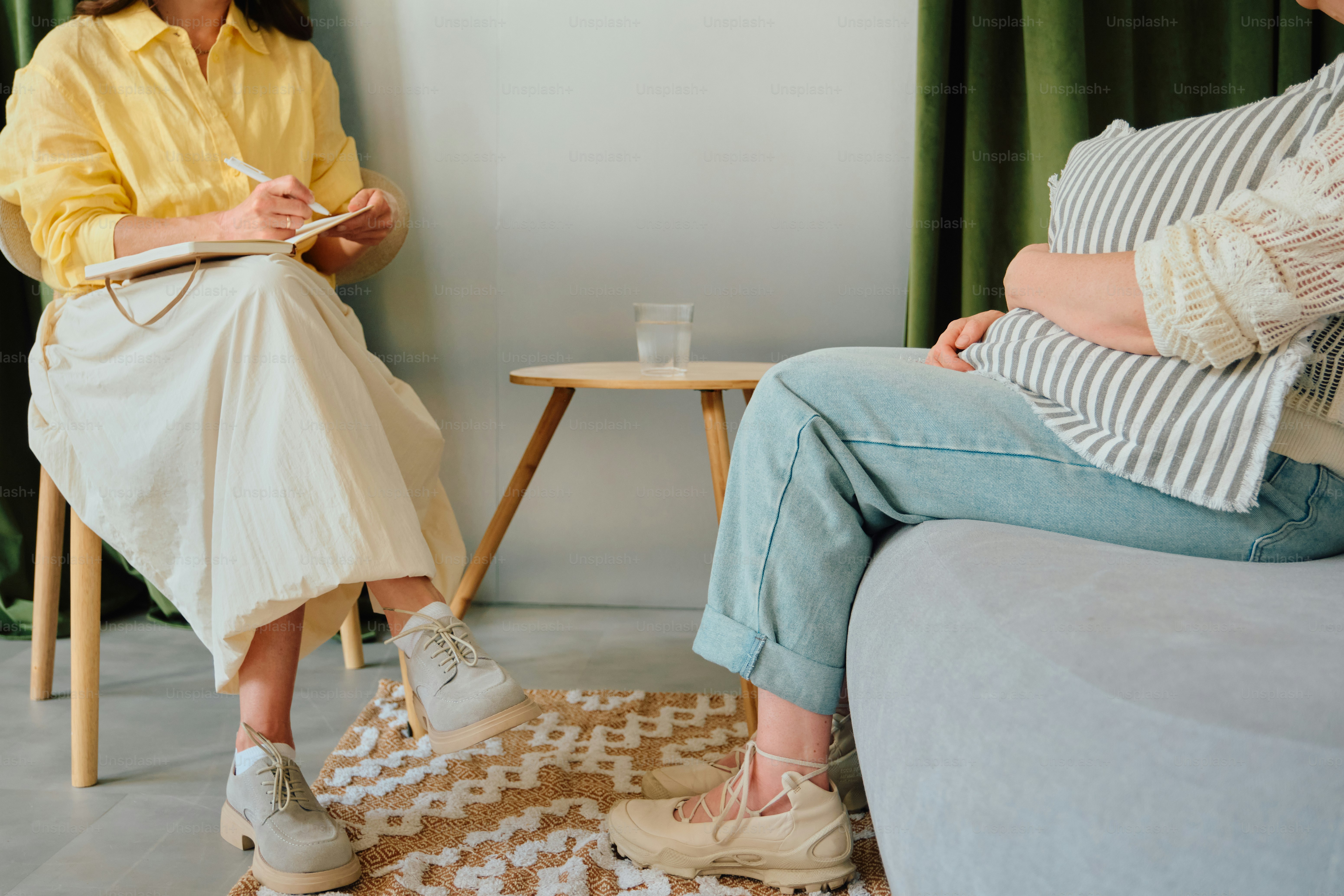 Therapist taking notes during anonymous counseling