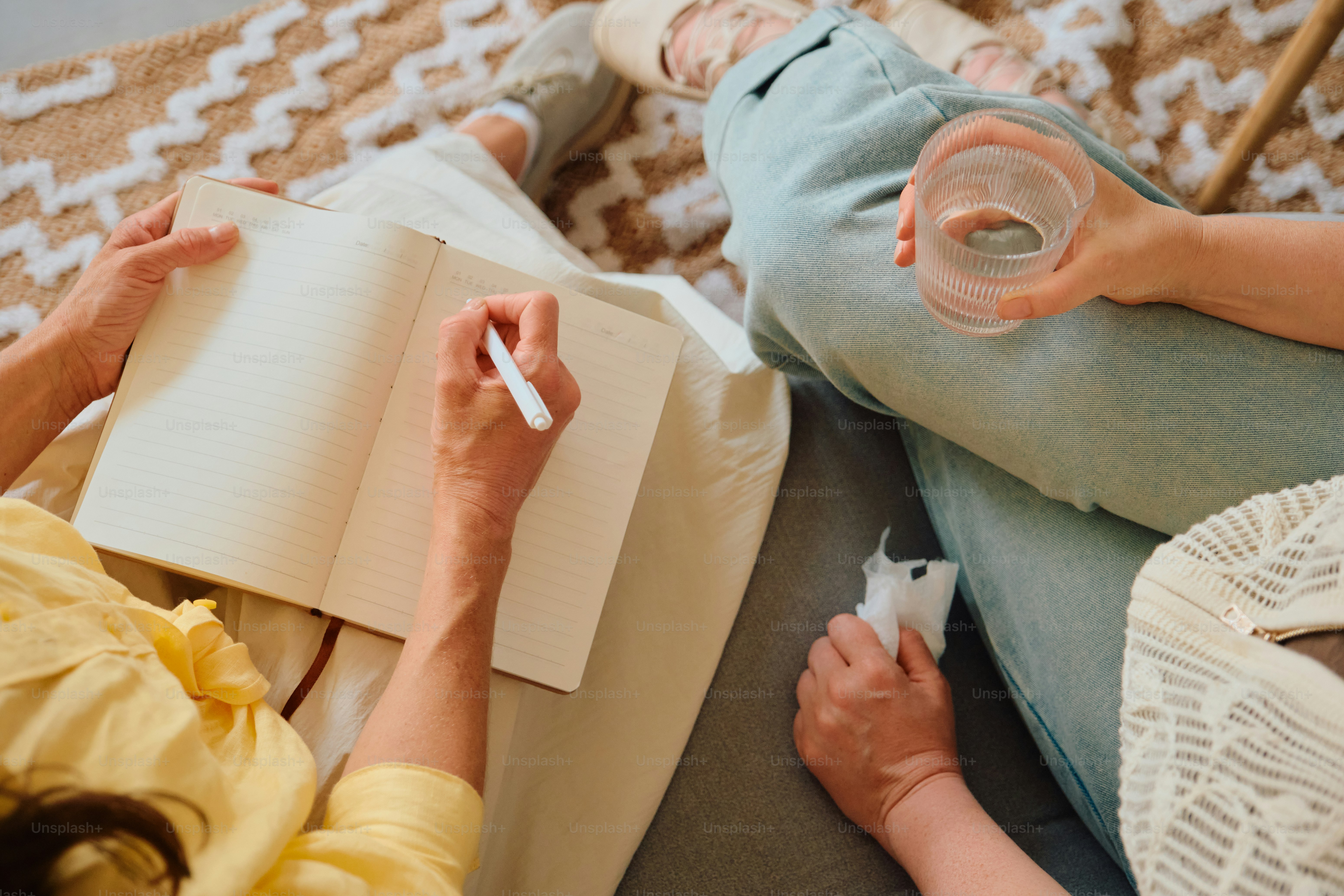People writing notes during a counseling session