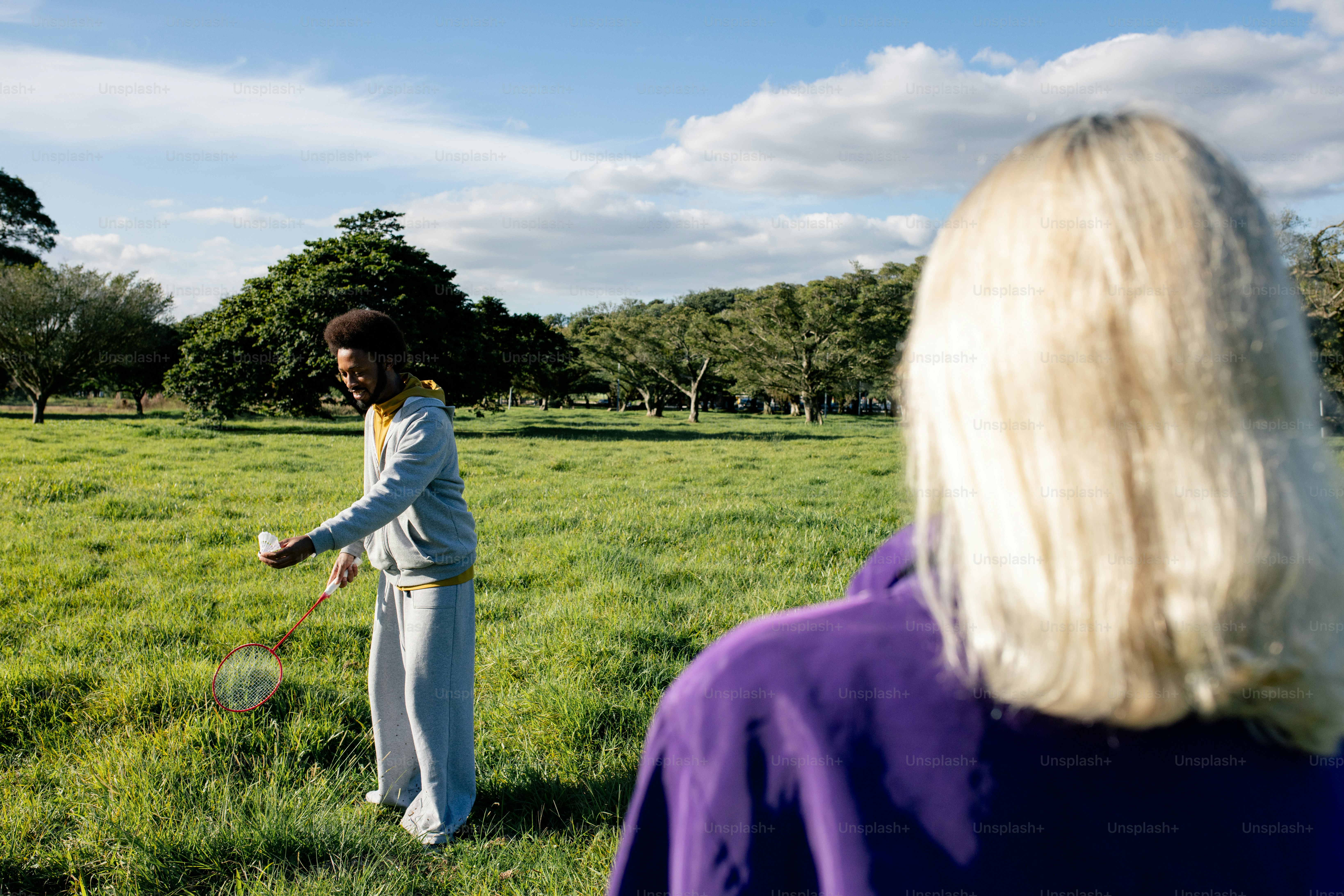Friends playing disc in sunny field