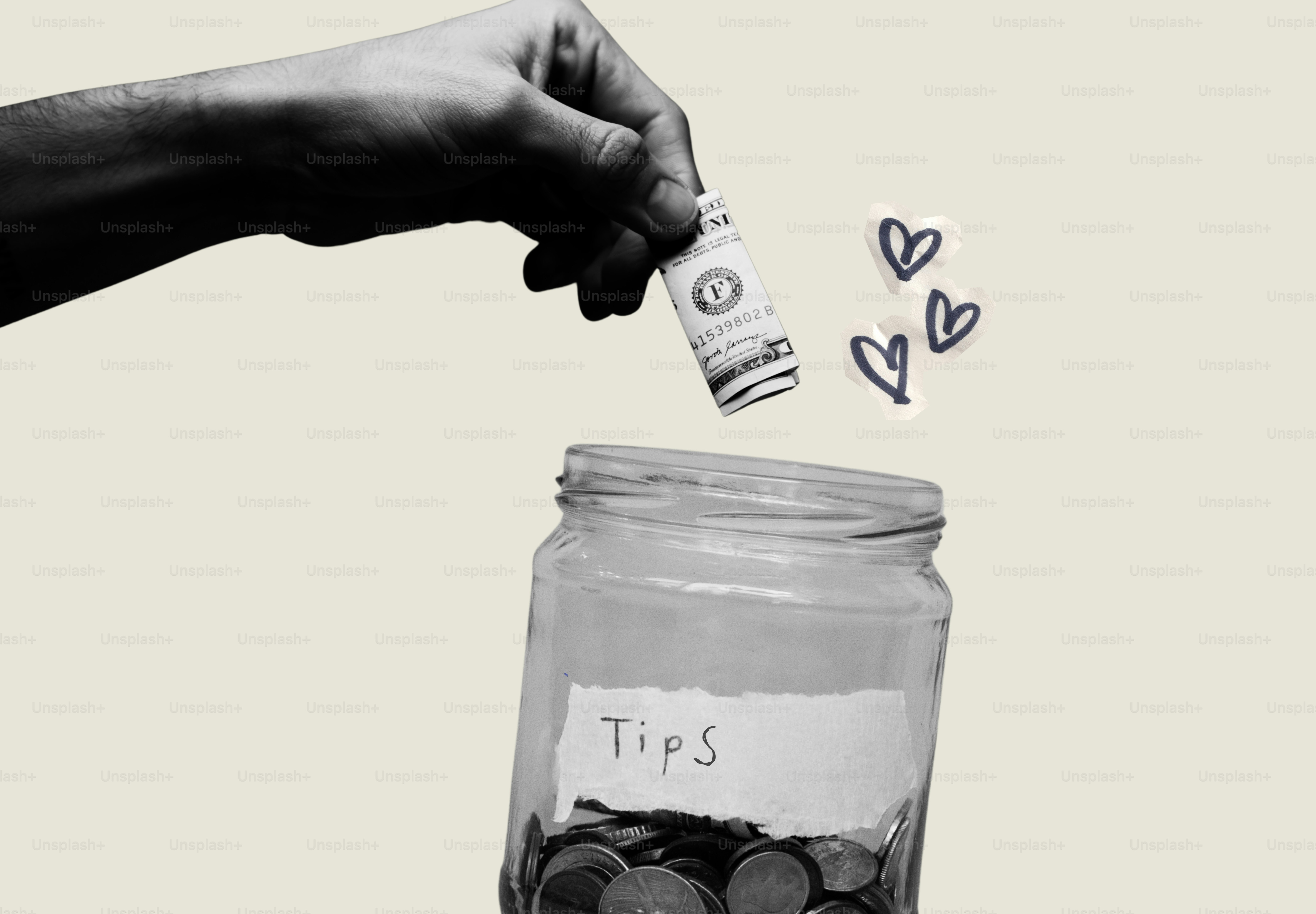 Hand putting dollar bill into "tips" jar