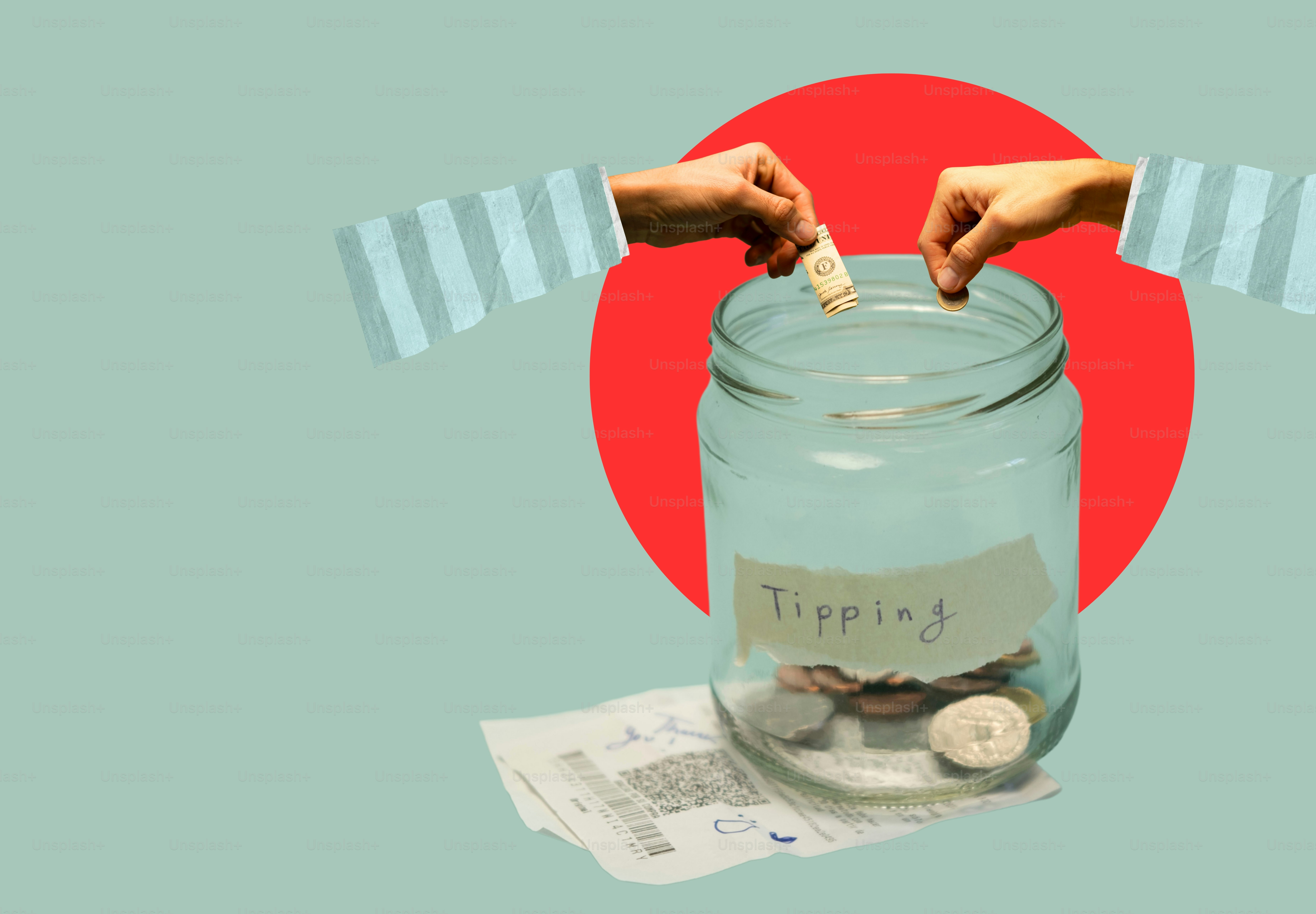 Hands putting money into a glass tipping jar