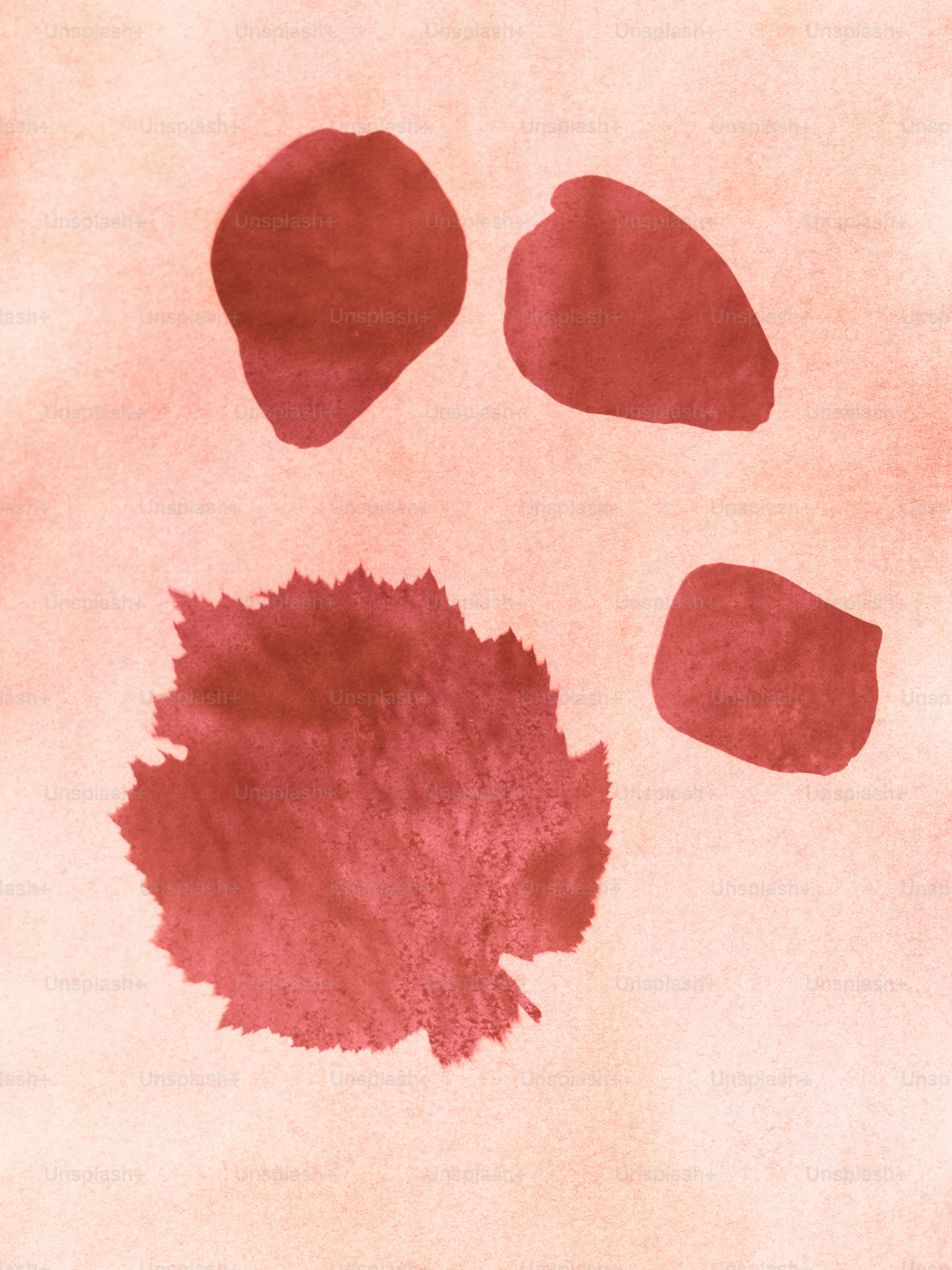 Abstract red shapes on a light pink background