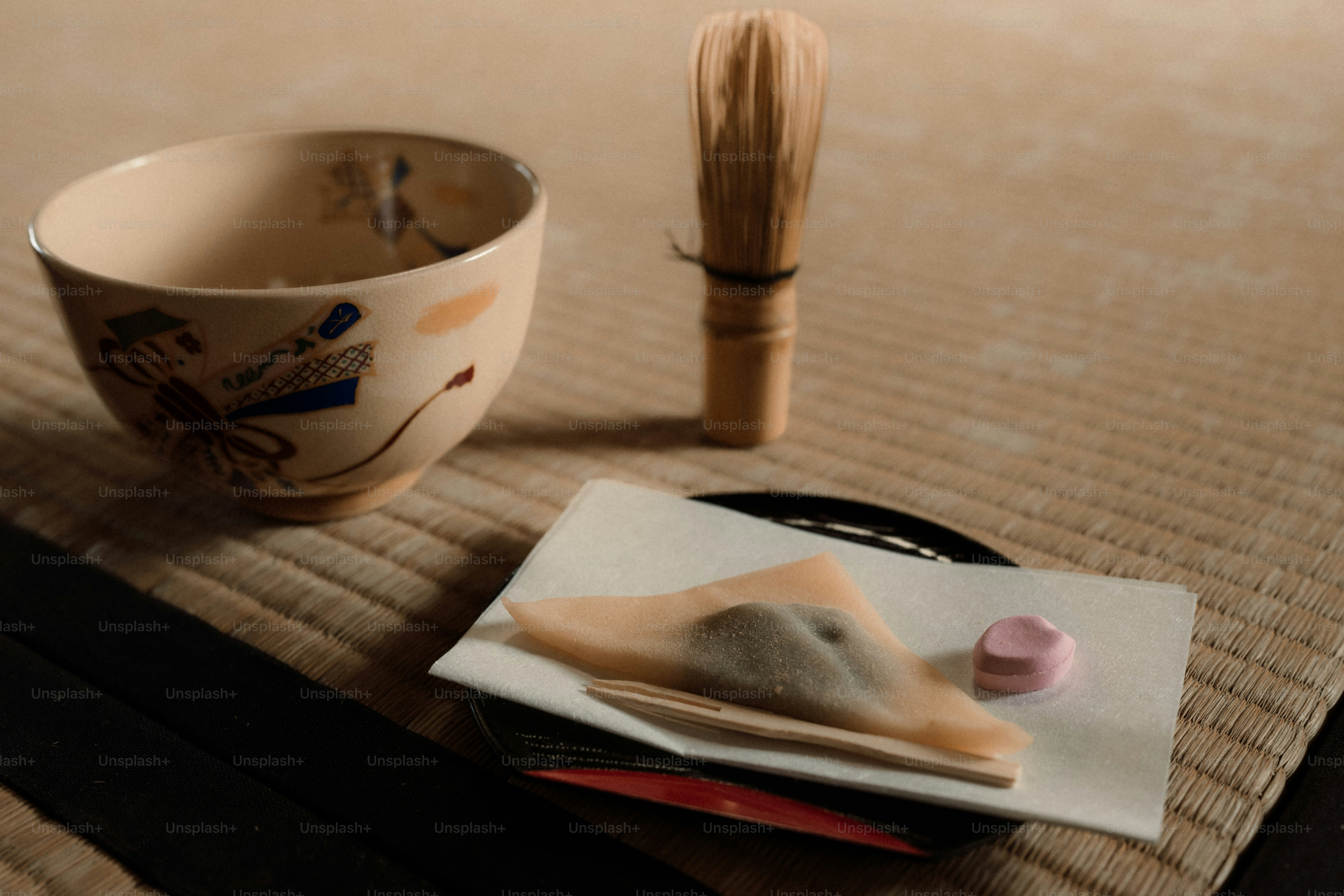 Traditional japanese tea set with sweet on mat