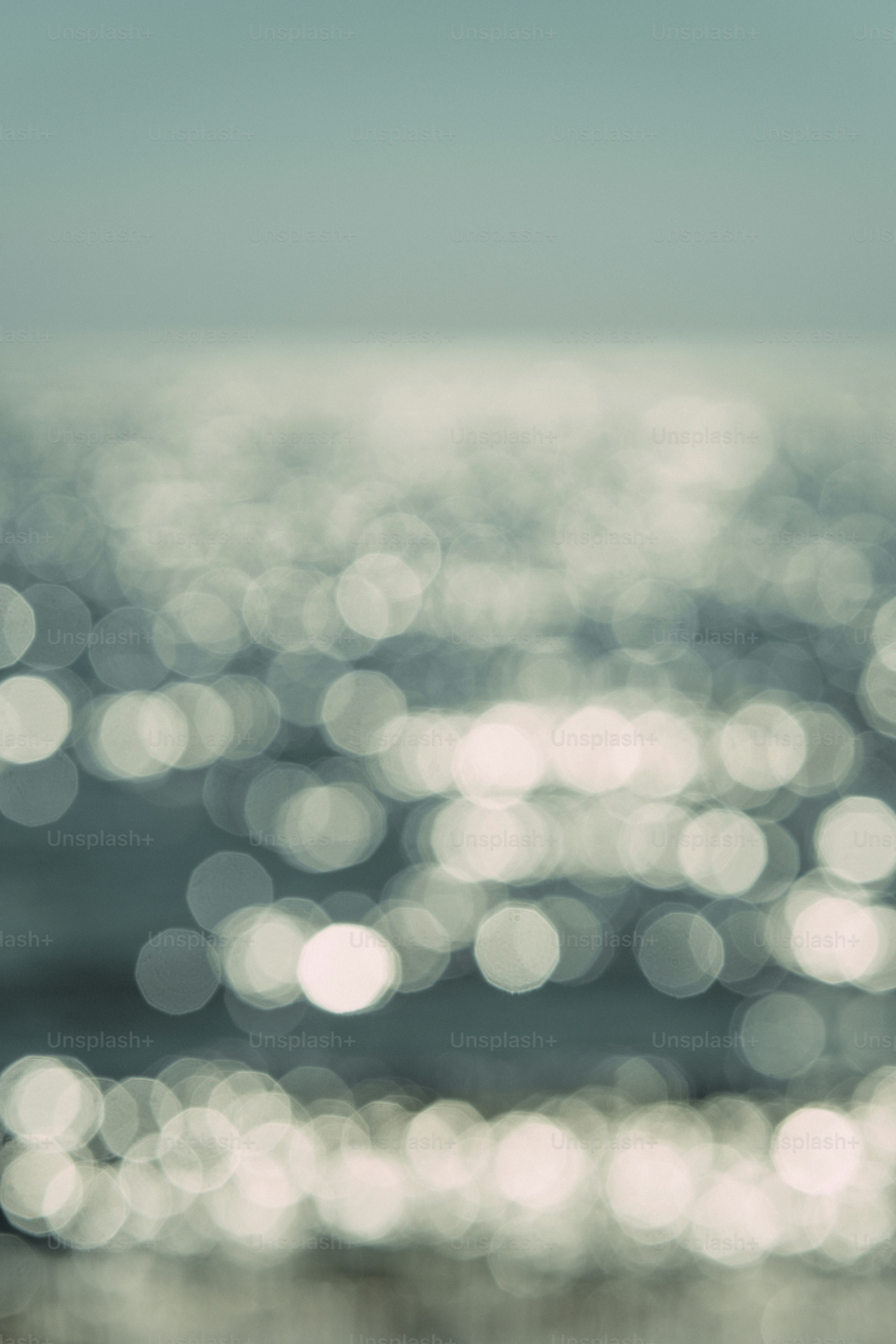 Shimmering water surface with light bokeh