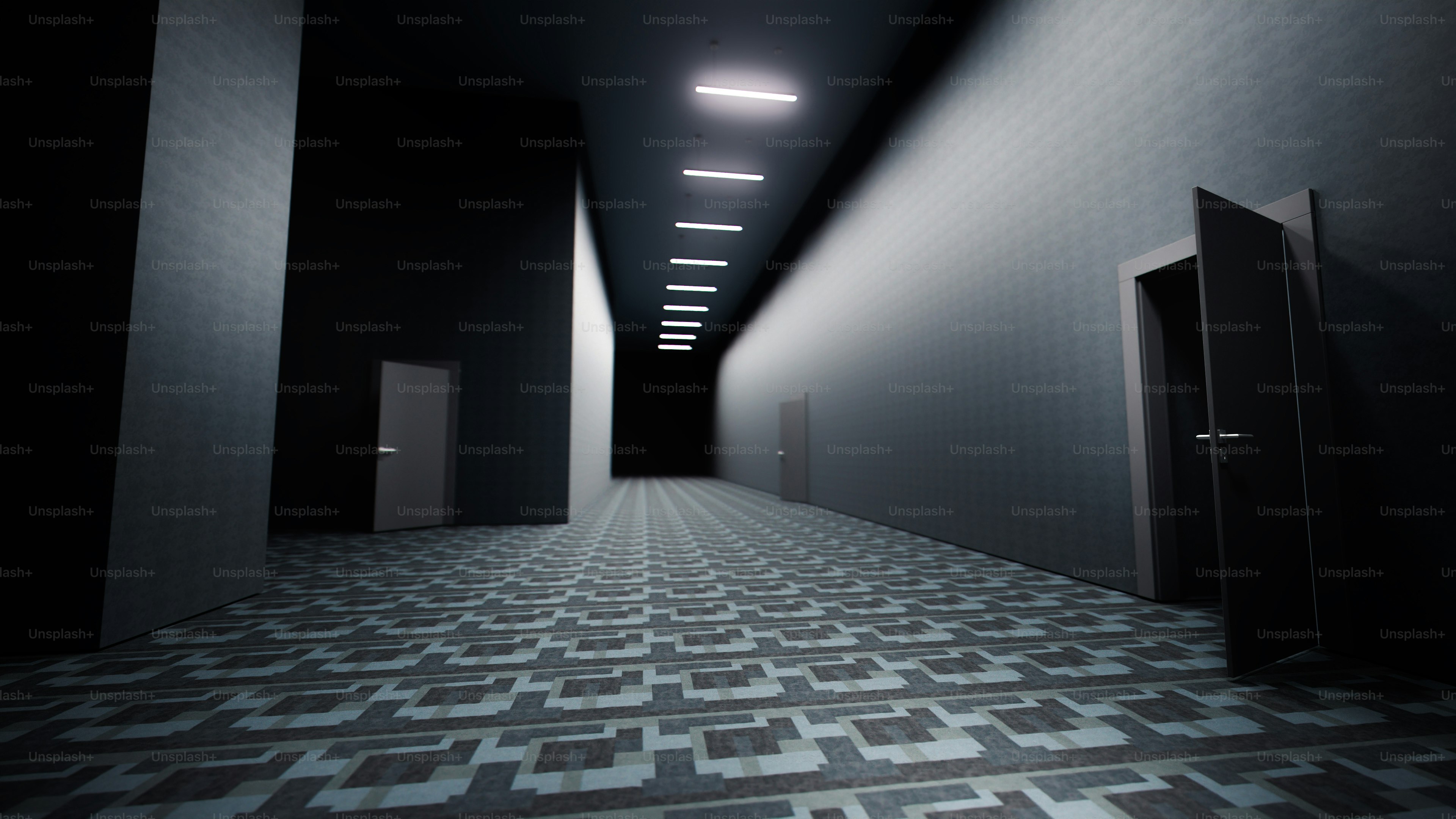 Dimly lit hallway with patterned floor and open door