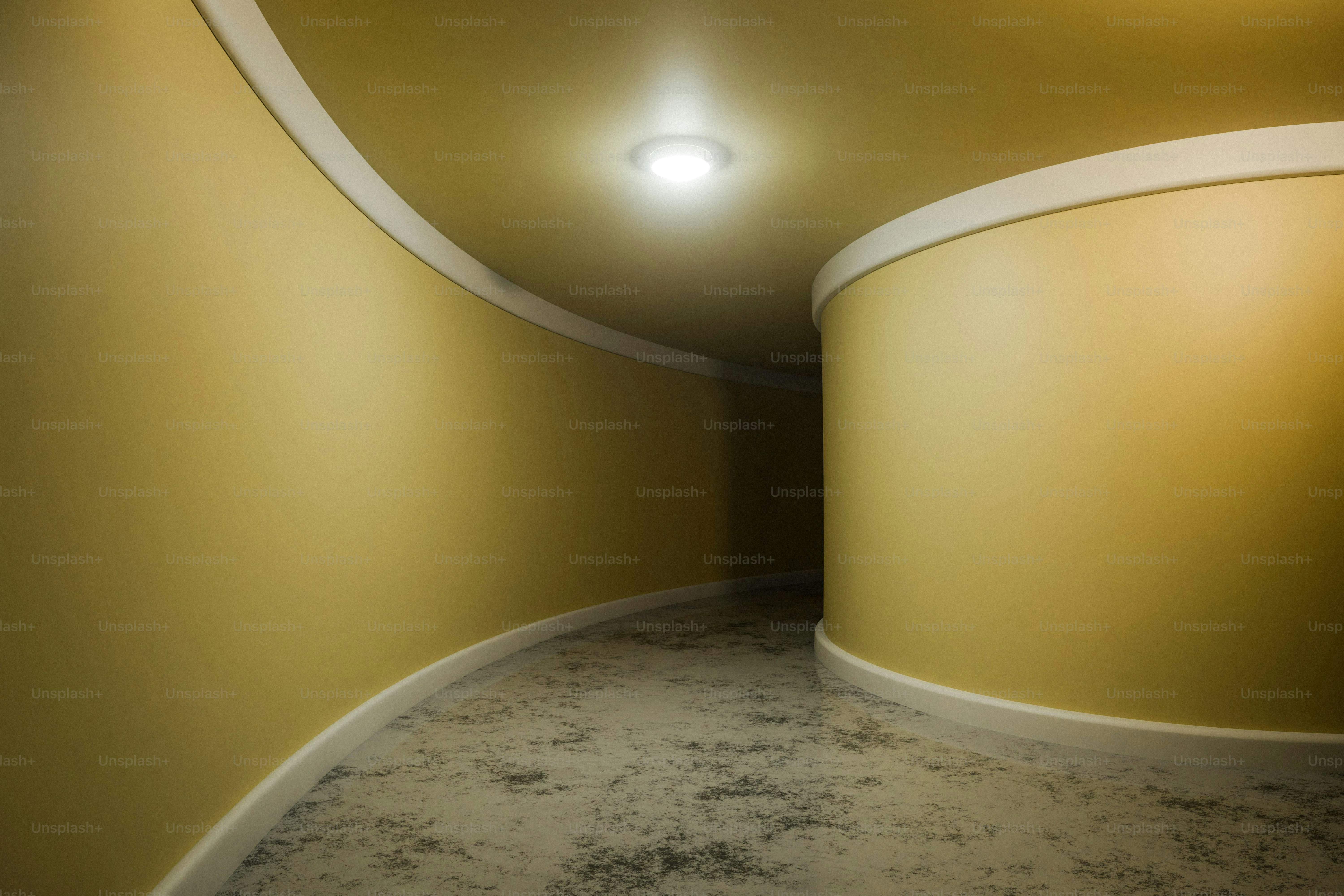 Yellow curved hallway with ceiling light