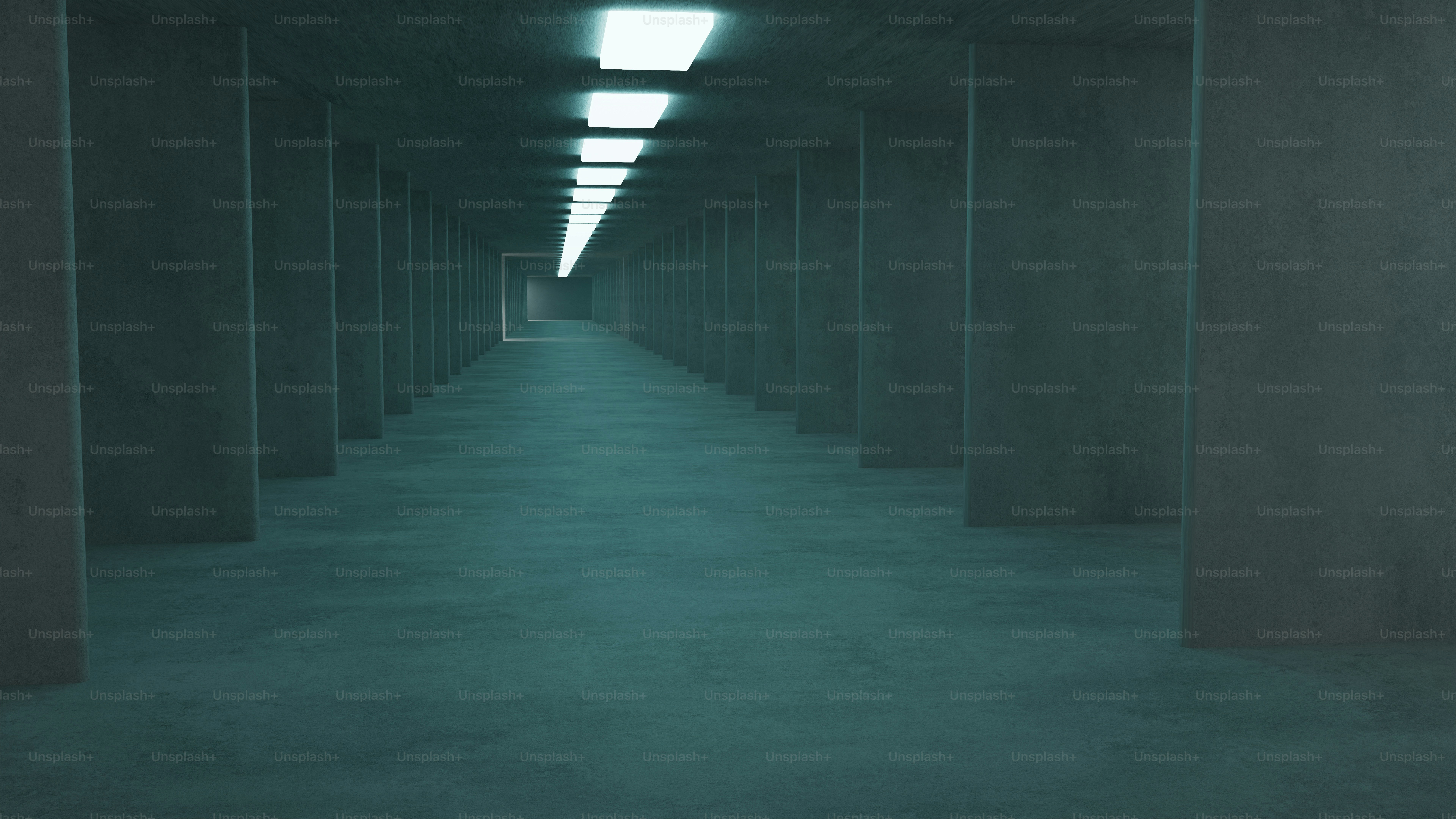 Long empty liminal corridor with distant fluorescent lights