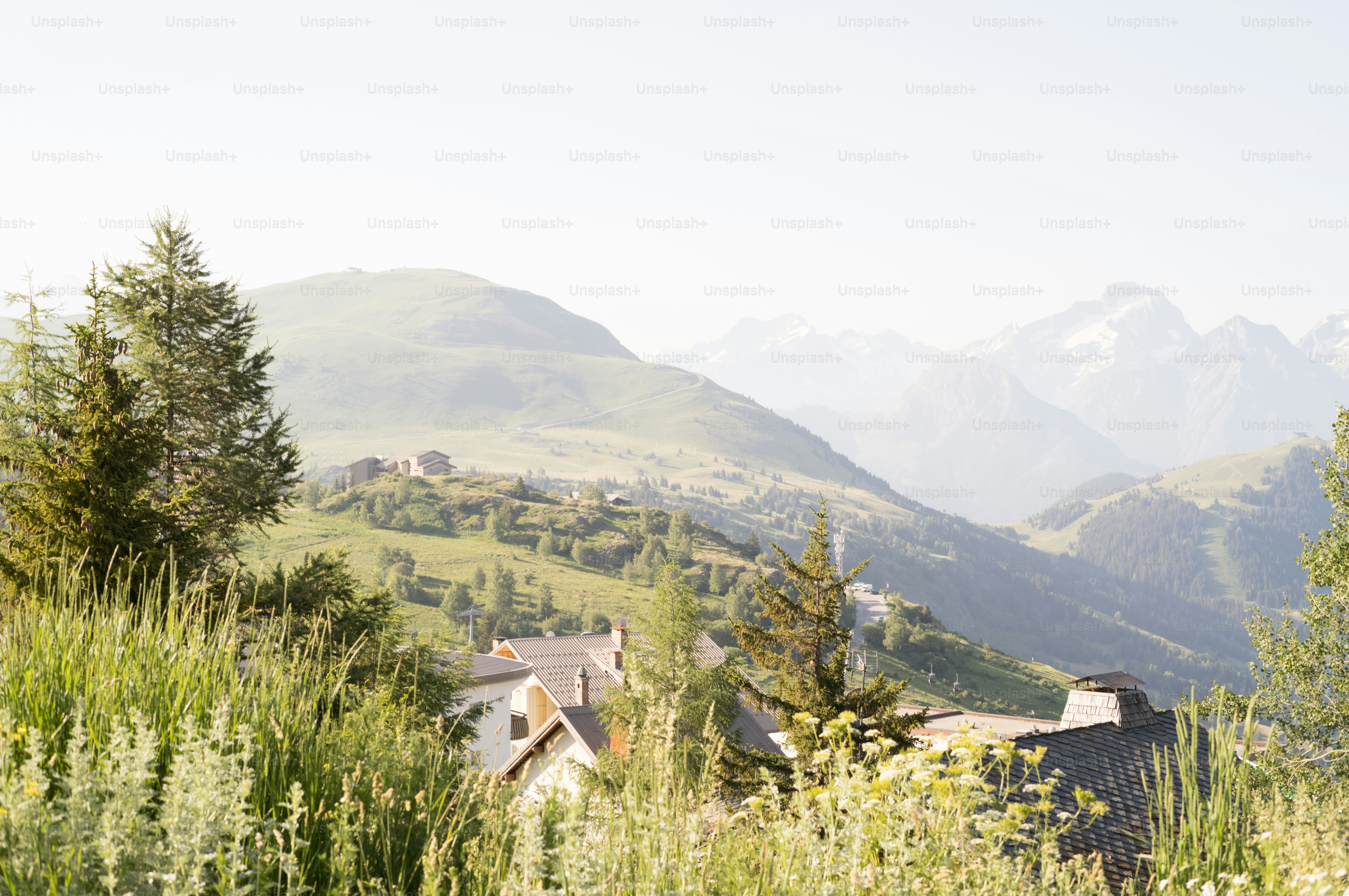 Hazy mountain village nestled among green hills