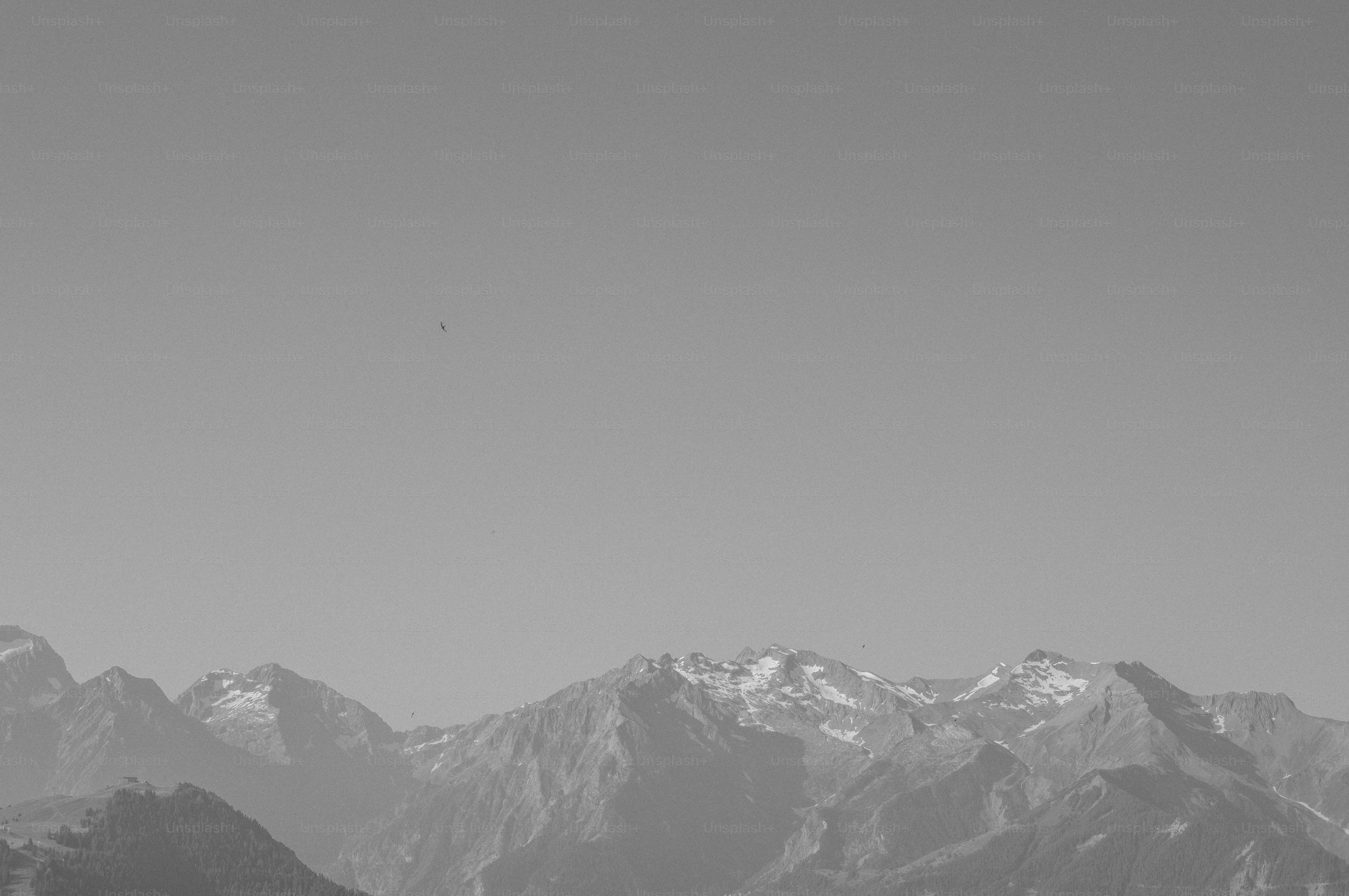 Snow-capped mountains under a clear sky