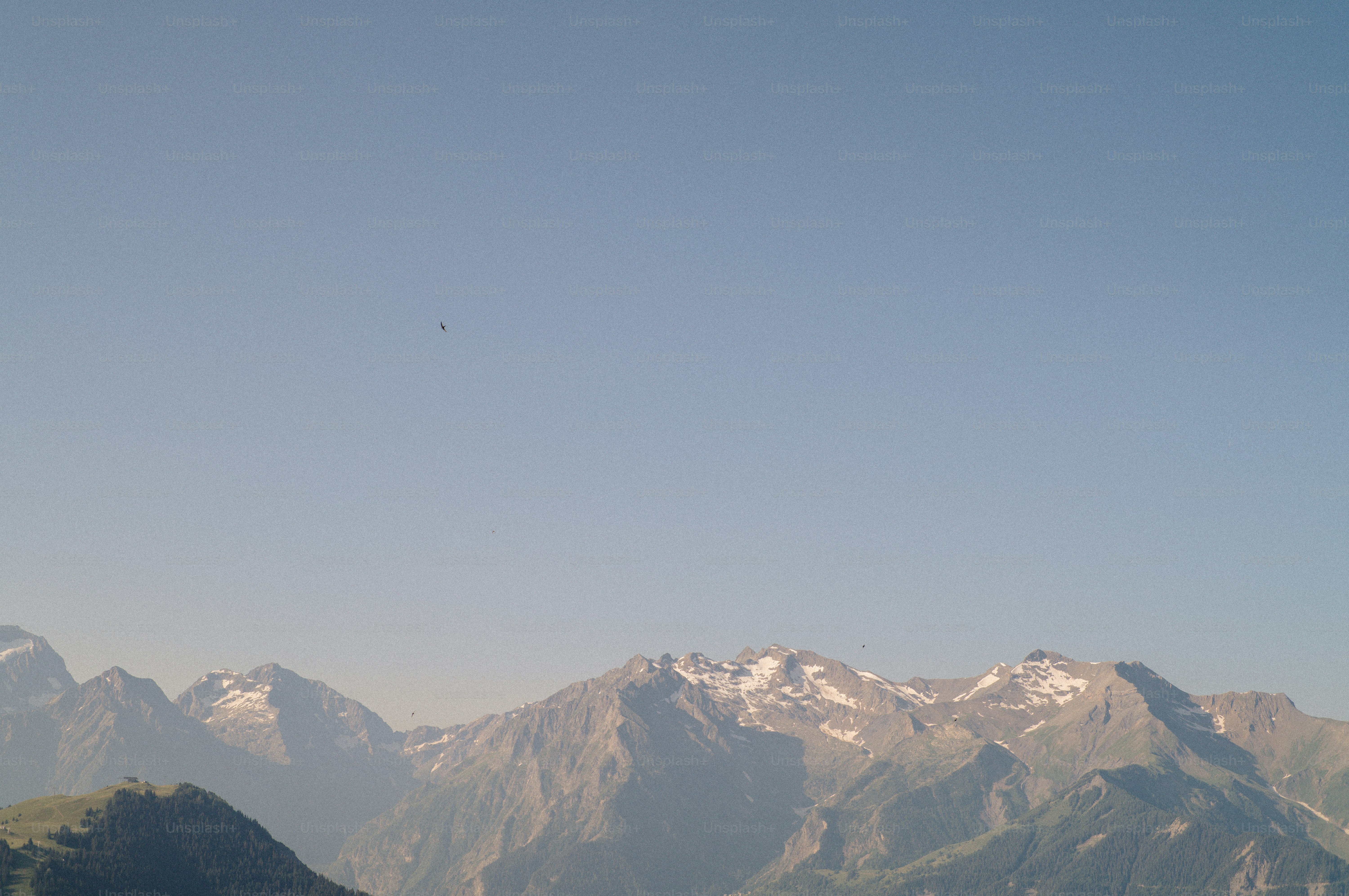 Snow-capped mountains under a clear blue sky