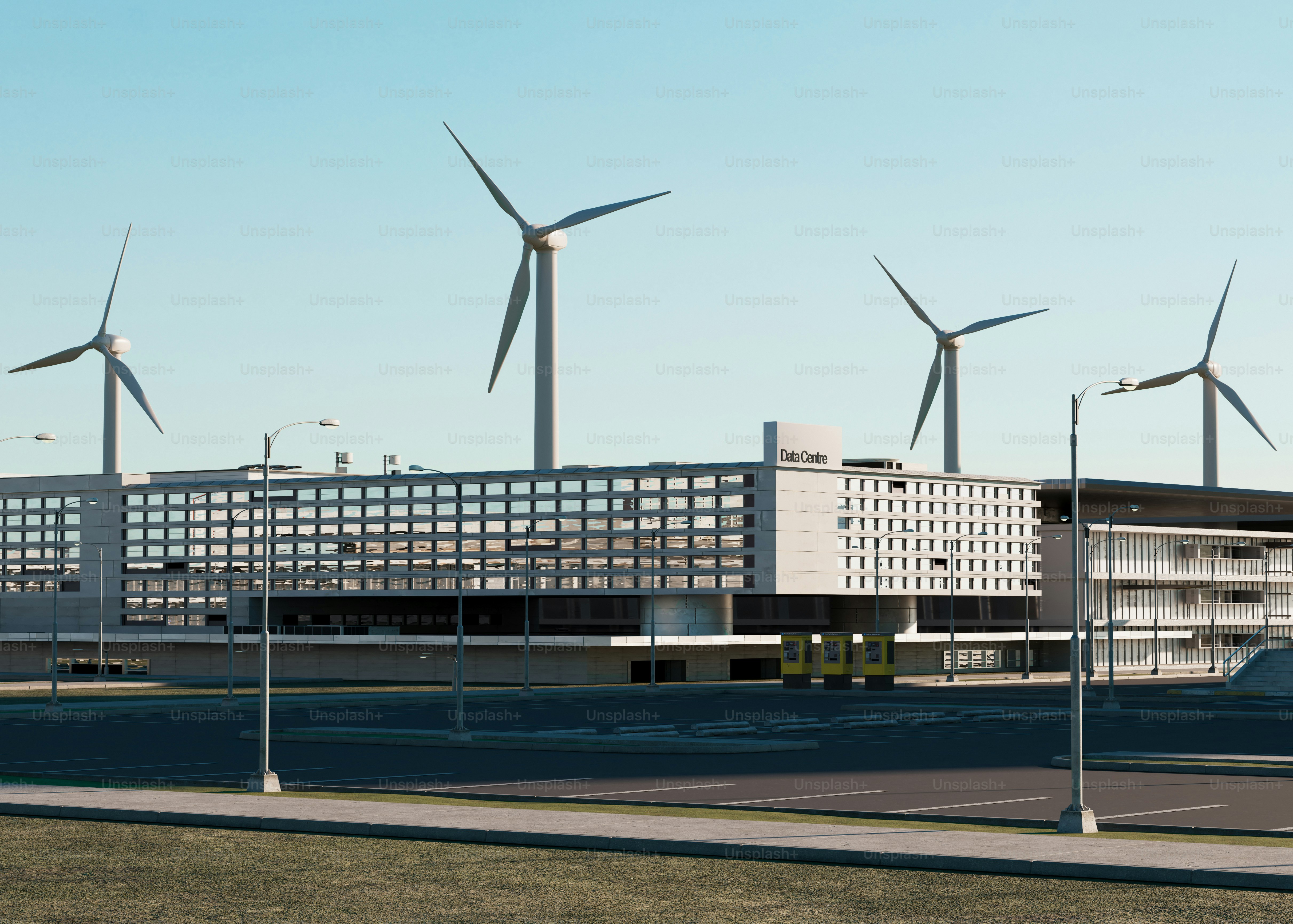 Wind turbines behind a modern building