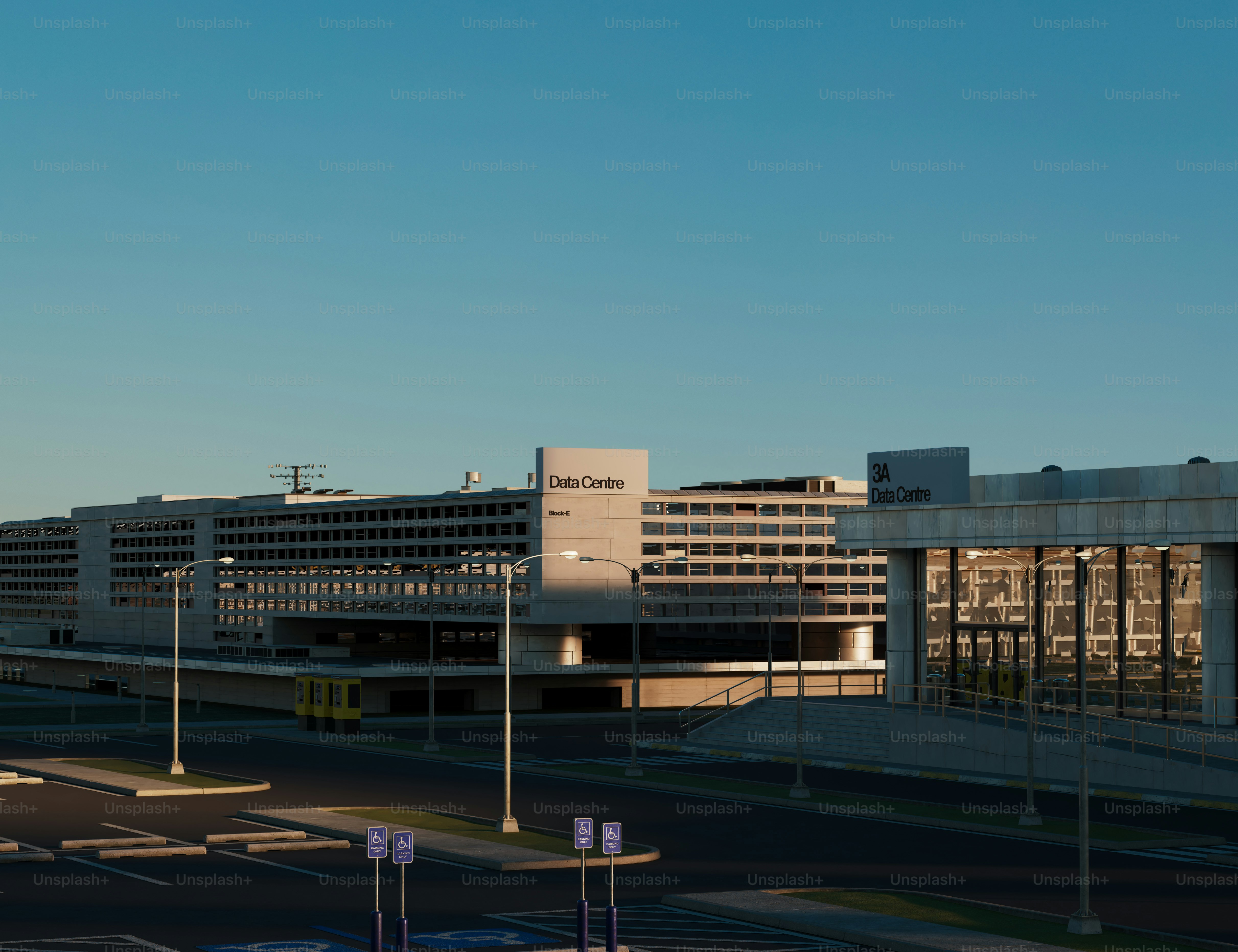 Large airport terminal building under clear blue sky