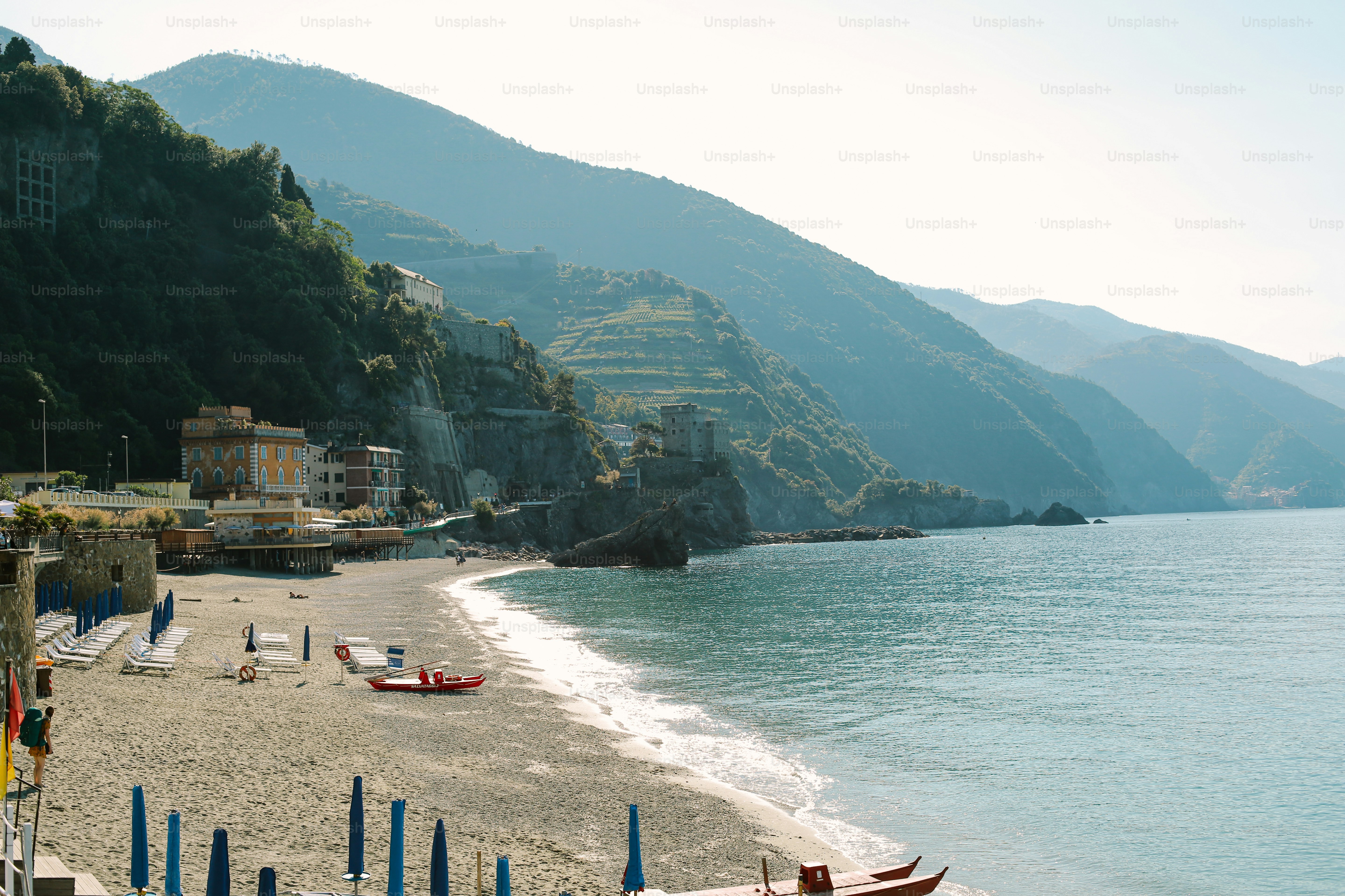 Beachfront village nestled against green mountains