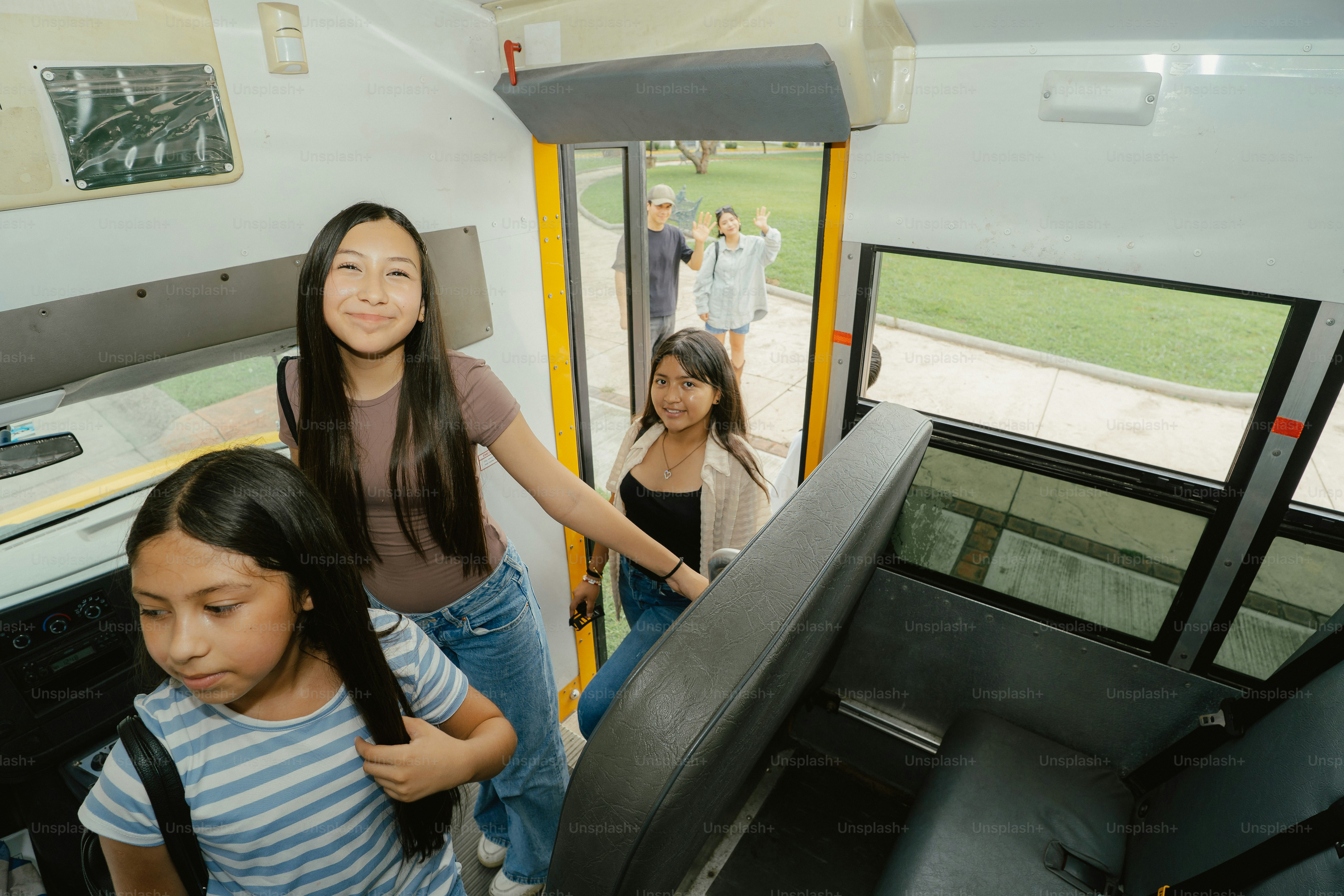 Girls boarding a school bus