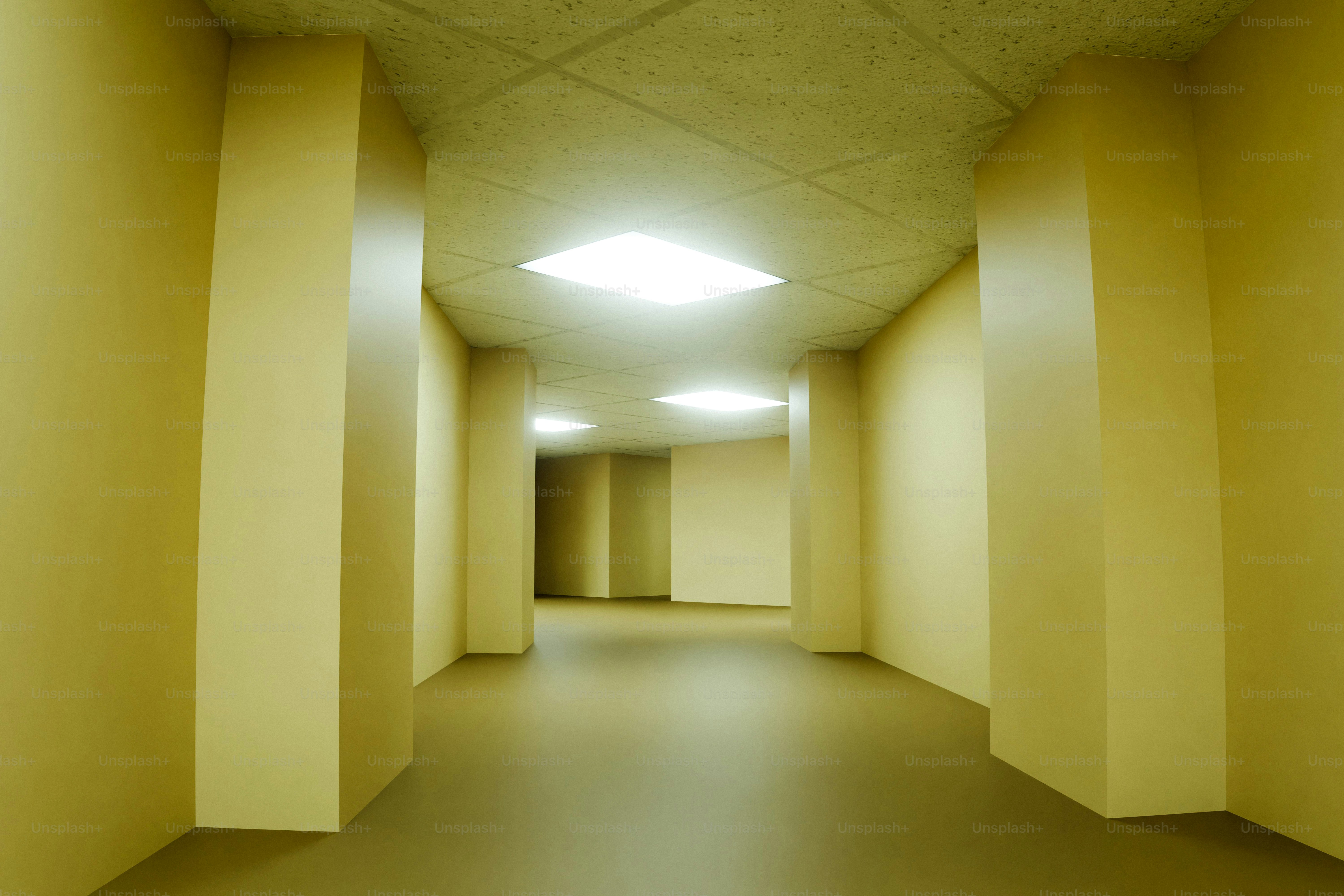Empty yellow hallway with fluorescent lights