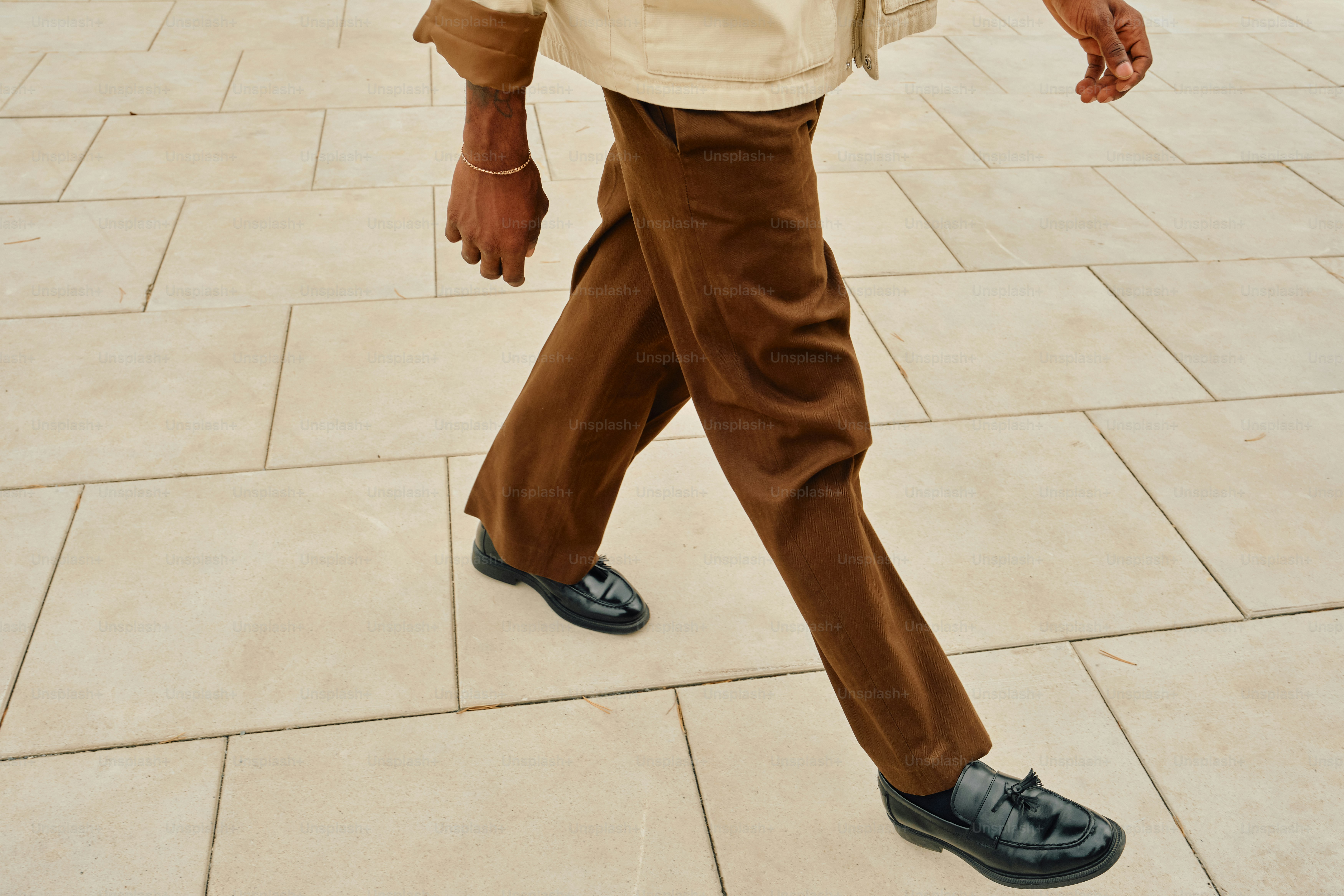 Styled men's loafers with brown trousers