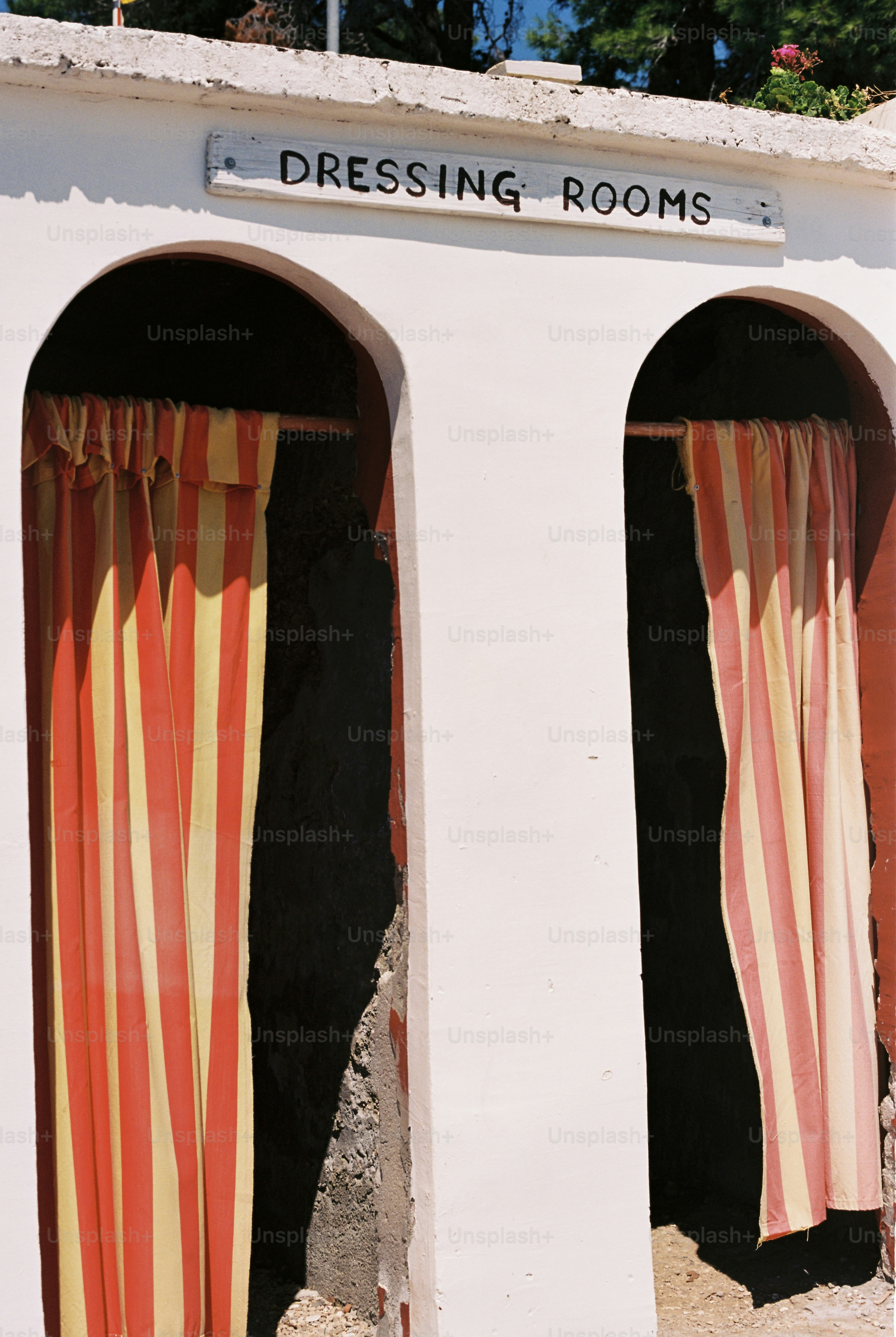 Dressing rooms with red and yellow striped curtains