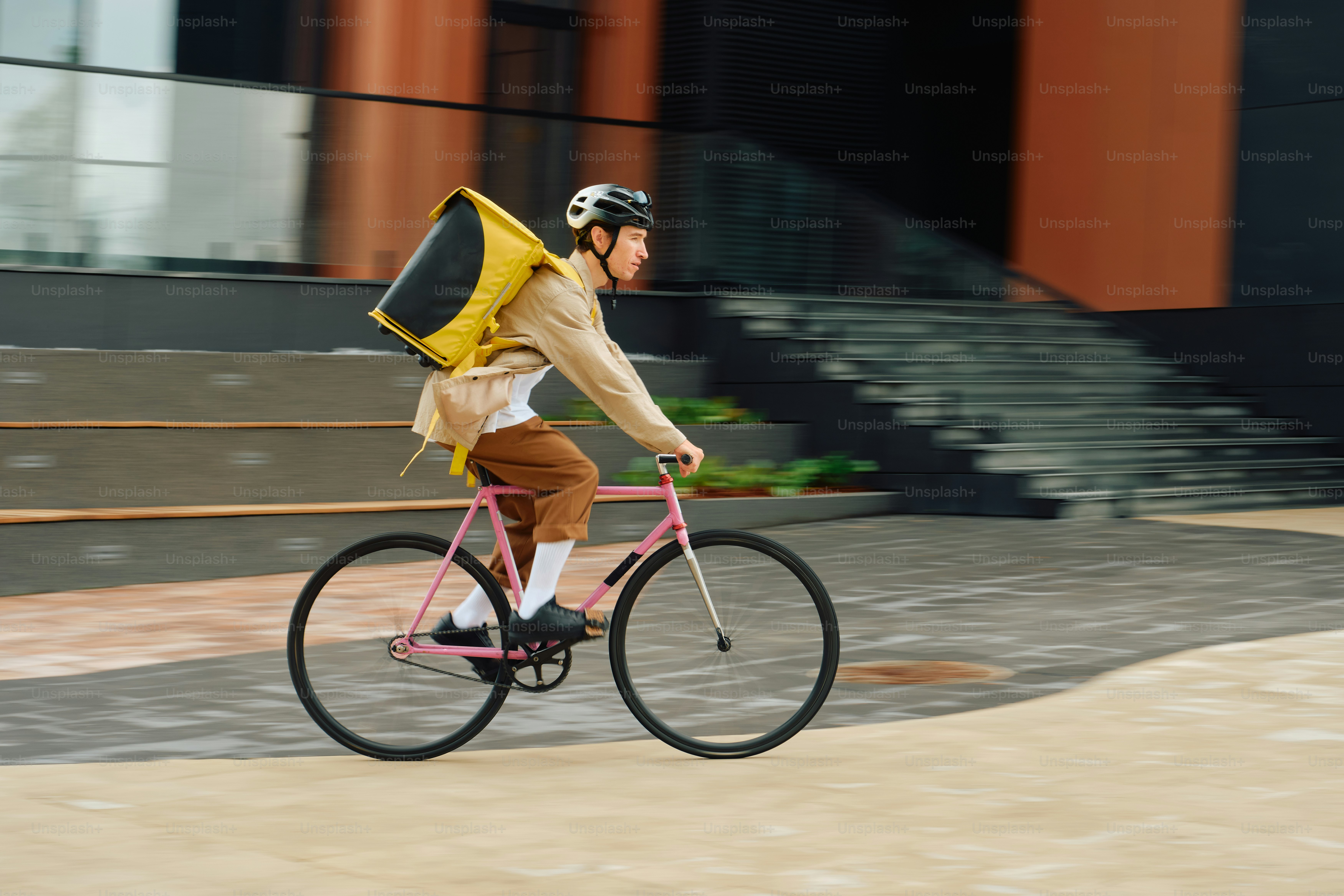 Food delivery rider cycling in modern city
