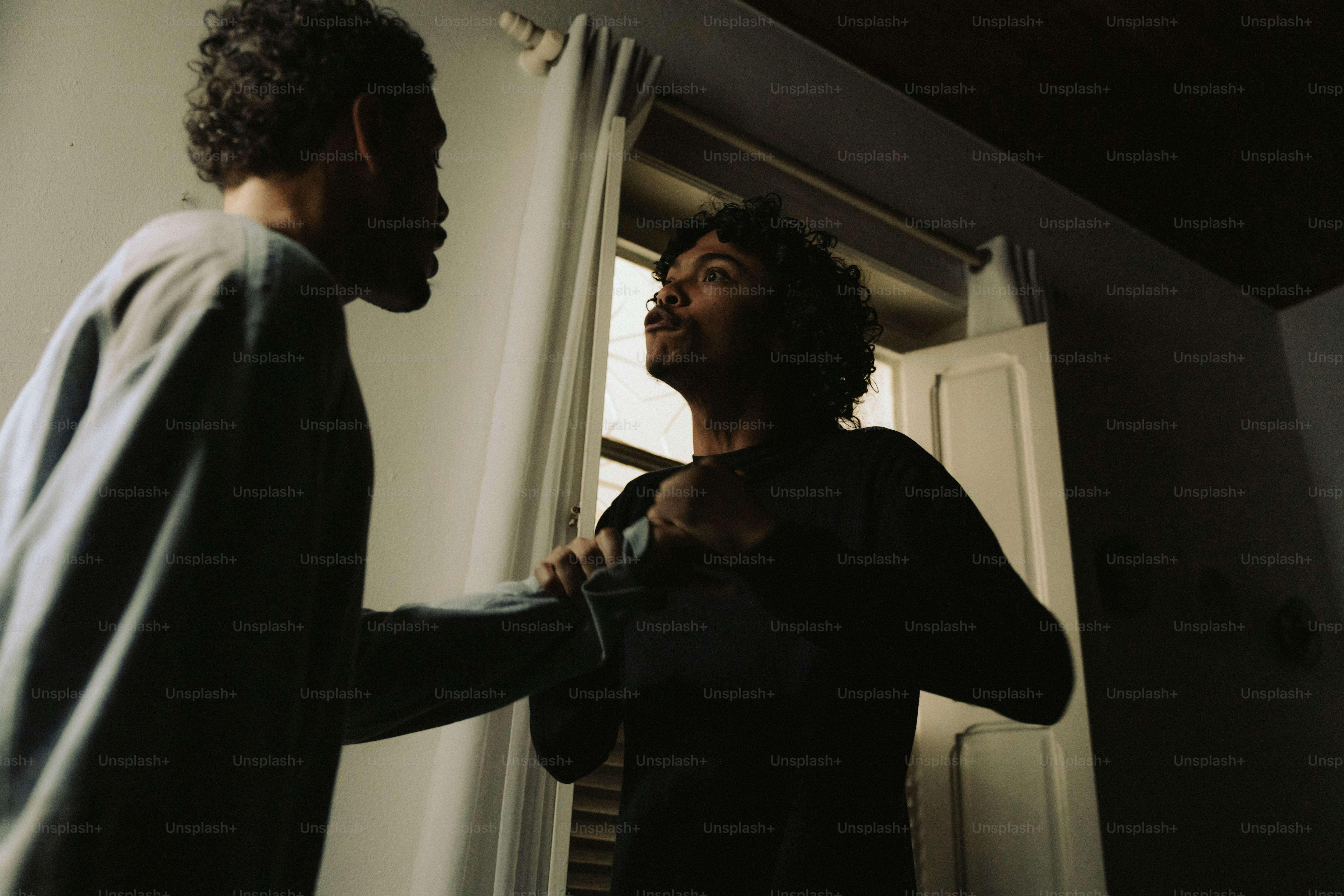 Dark silhouette of couple in domestic dispute