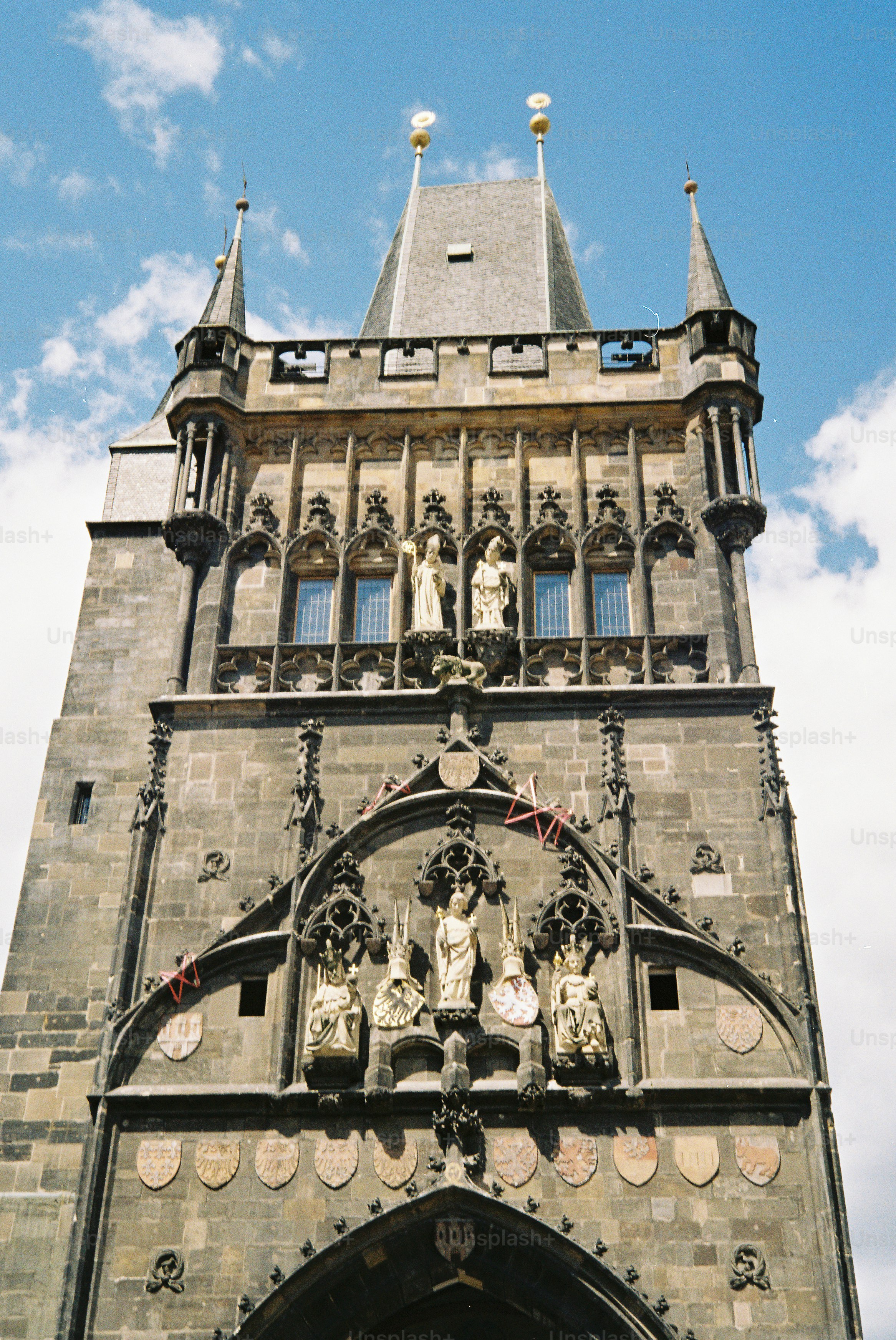 Ornate historic stone tower with statues
