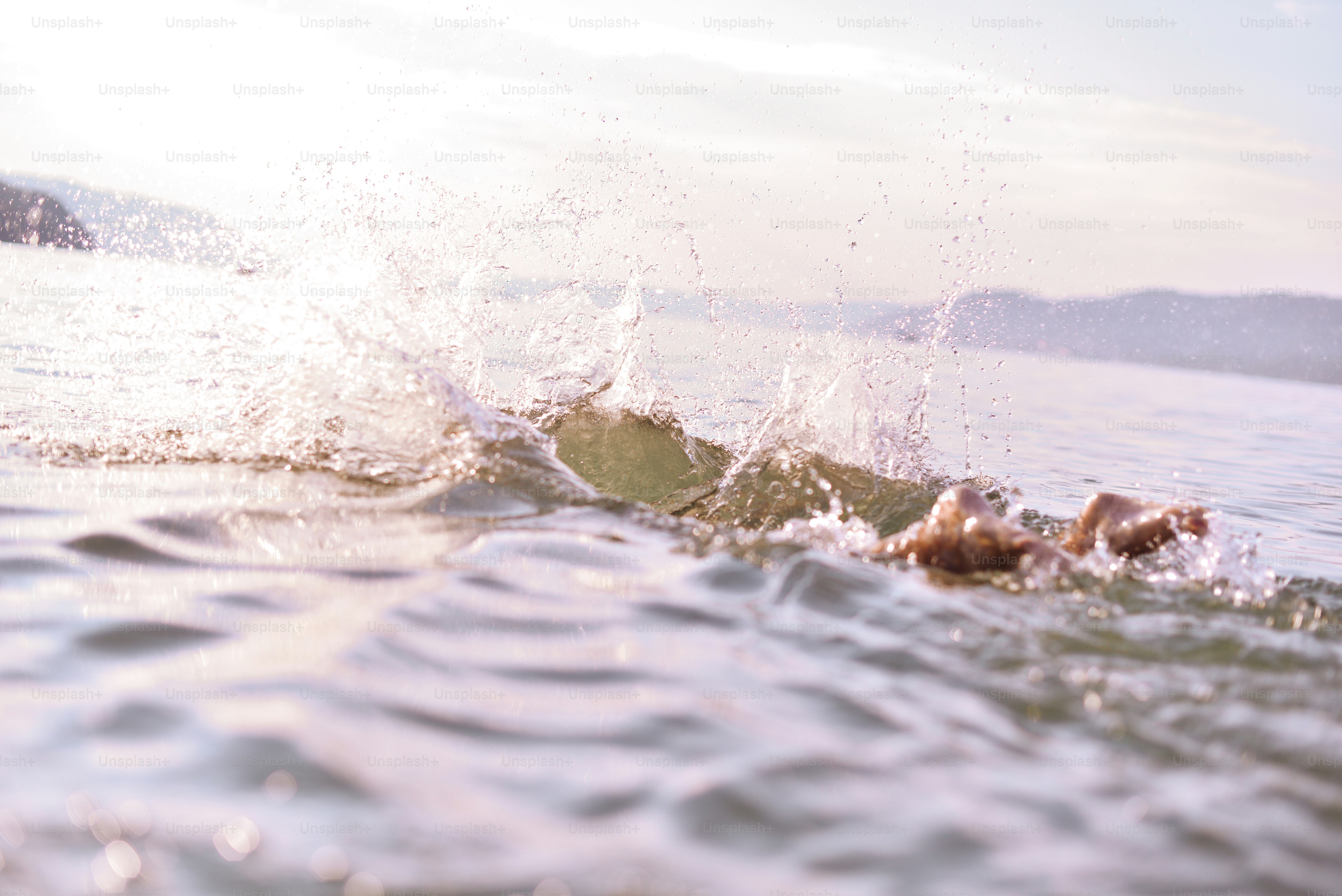 Swimmer creating a splash in open water