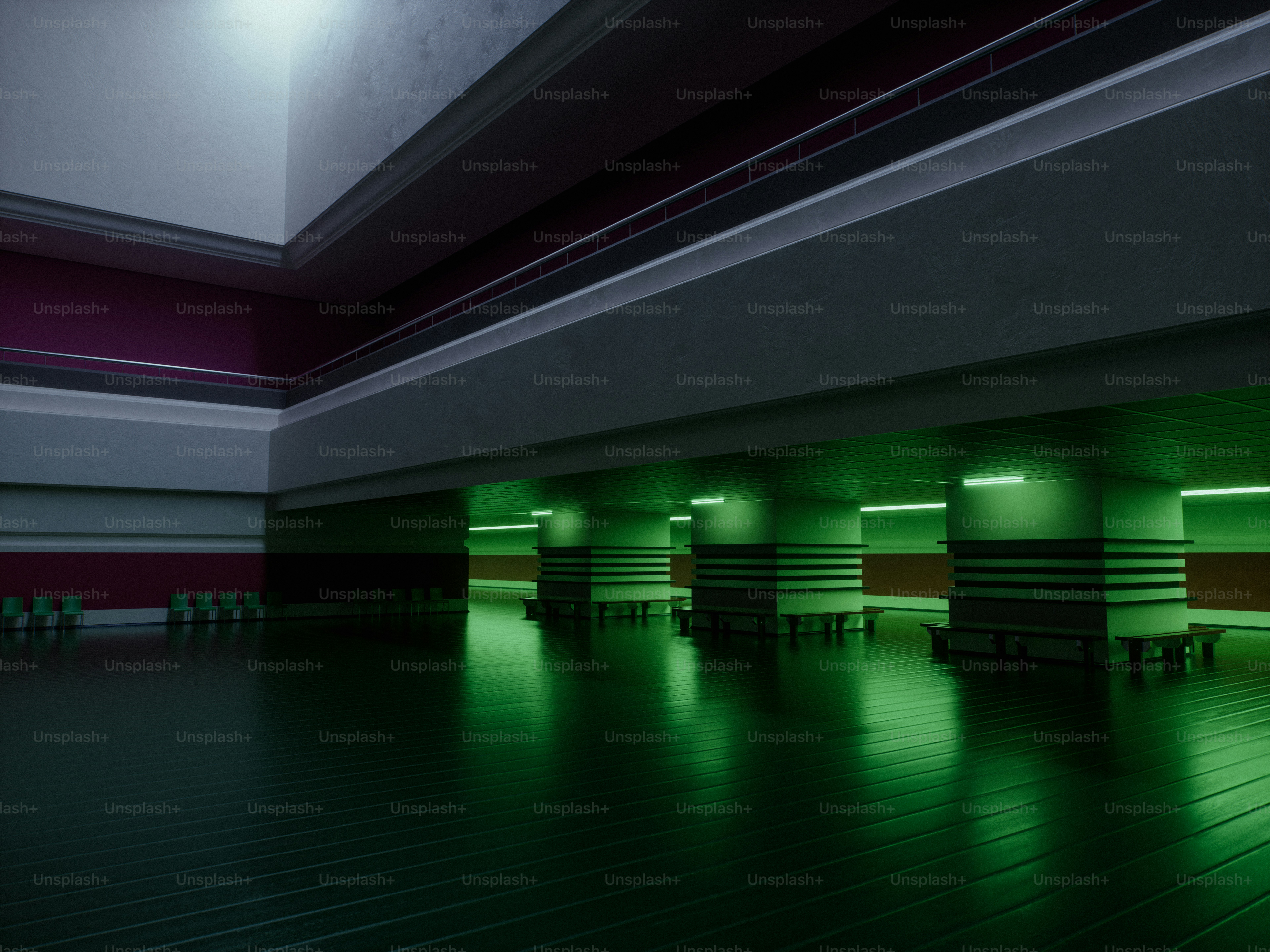 Modern hall with green illuminated pillars and reflective floor