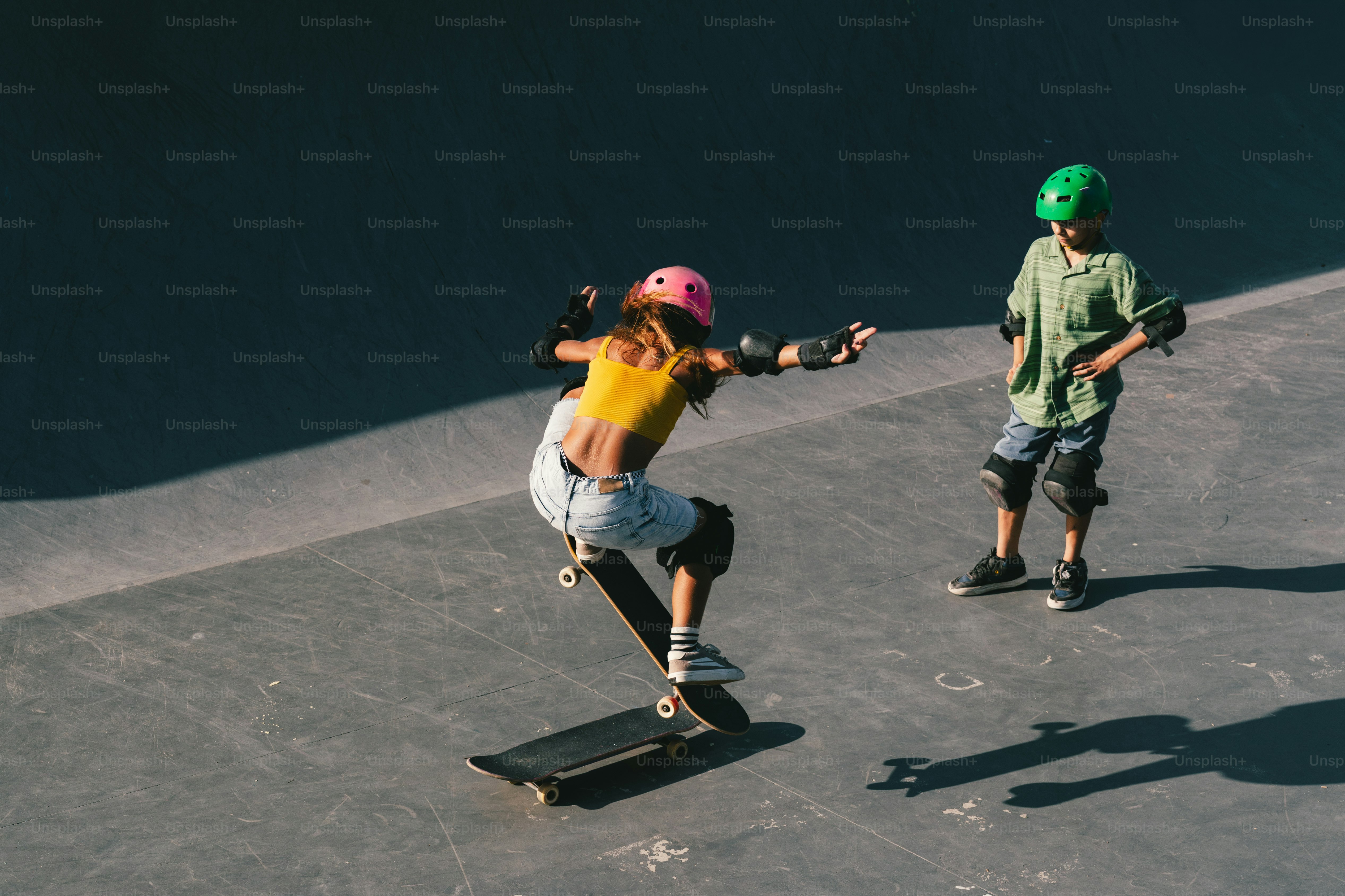 Young skateboarders practicing tricks at a skatepark