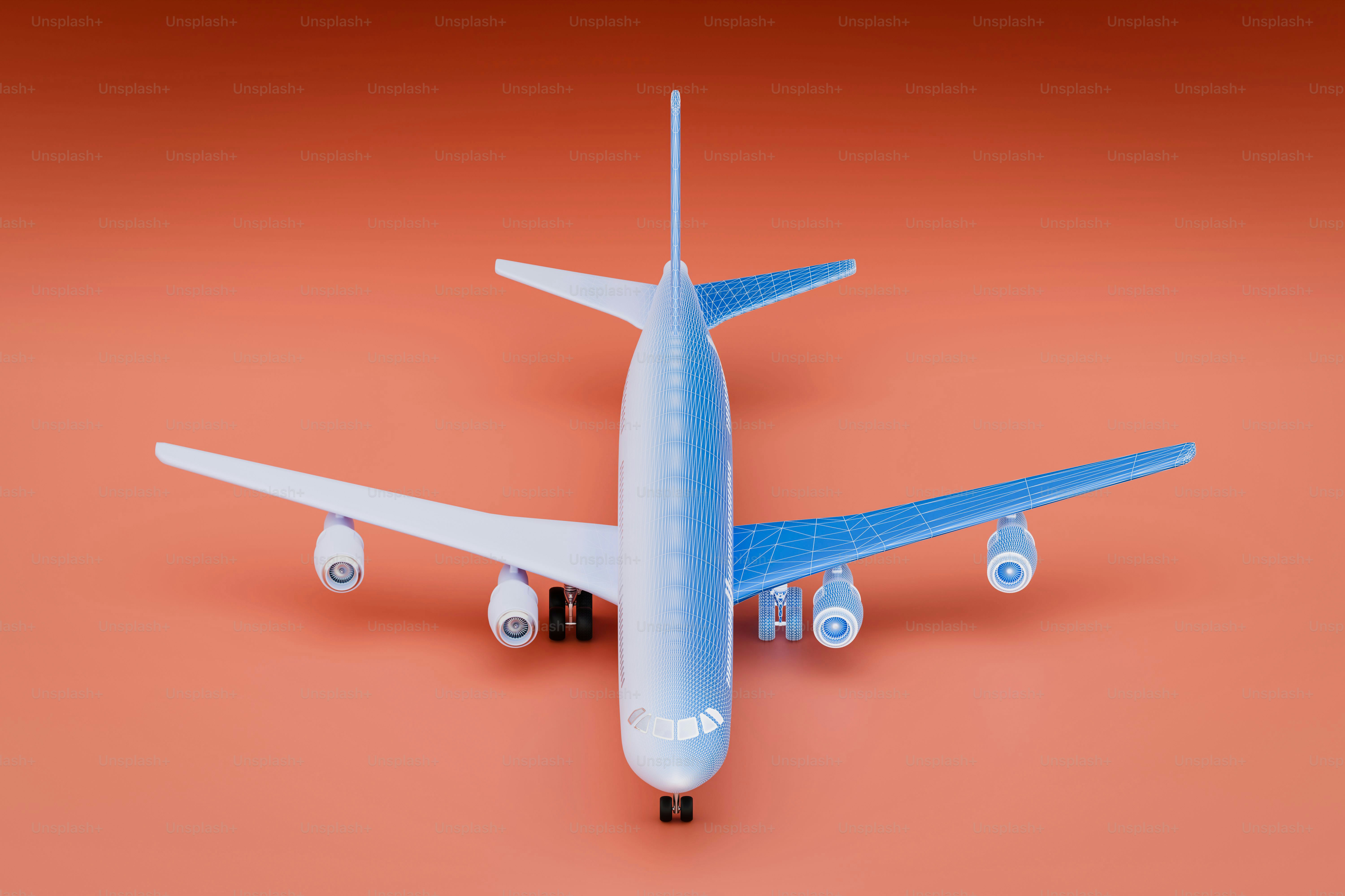 White model airplane against orange background