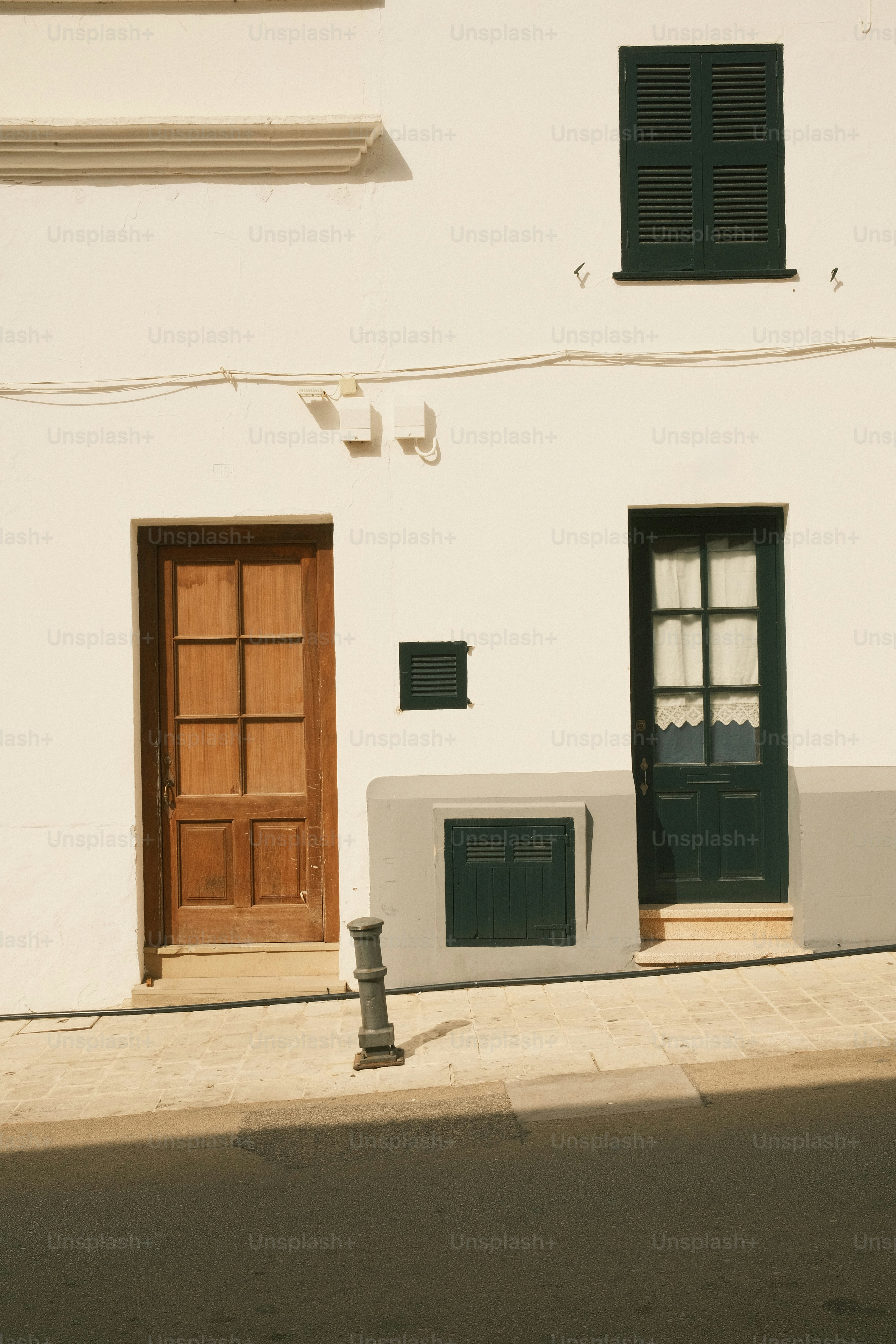 Building facade with two doors and a window