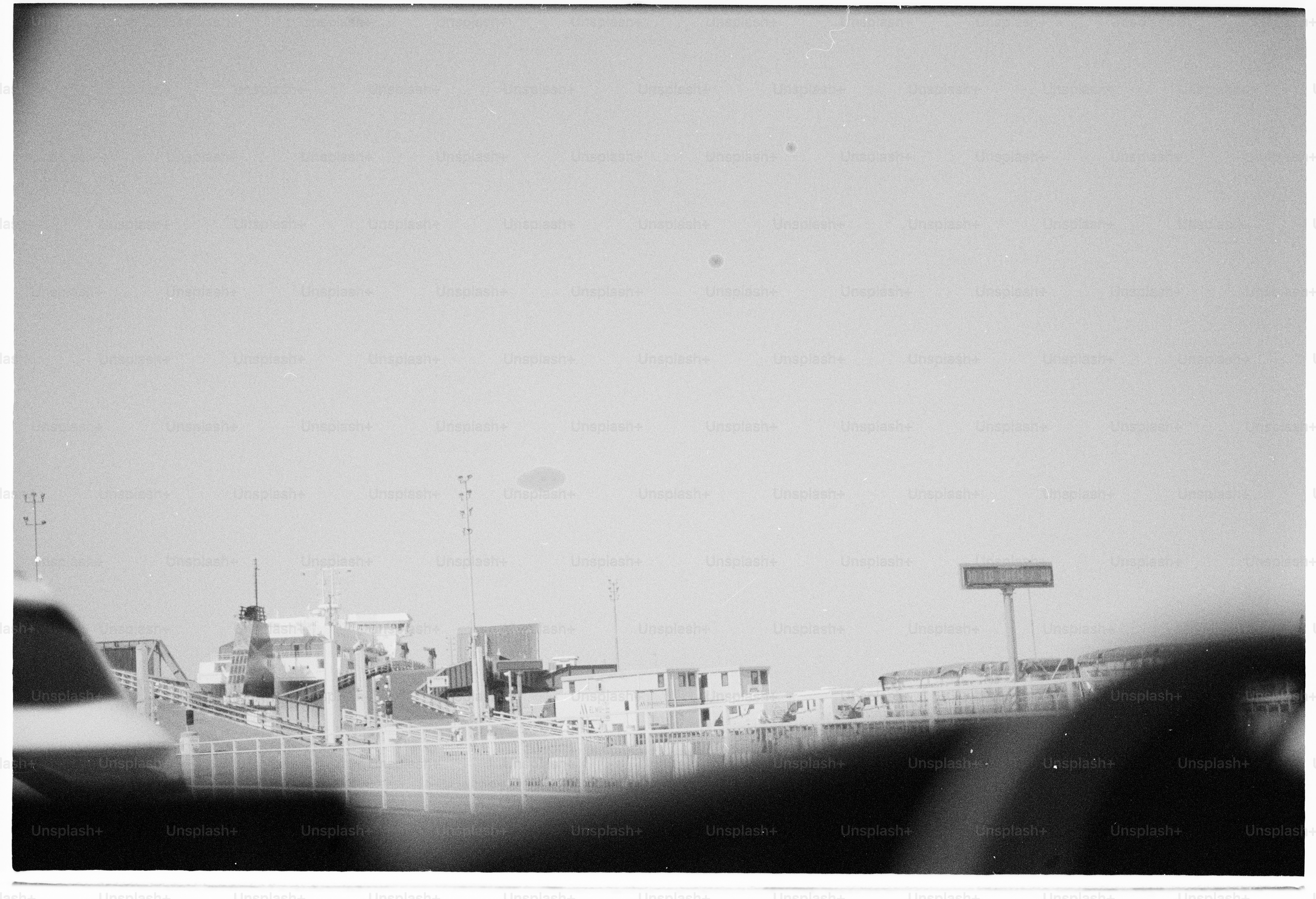 Monochrome urban scene with buildings and a distant sign