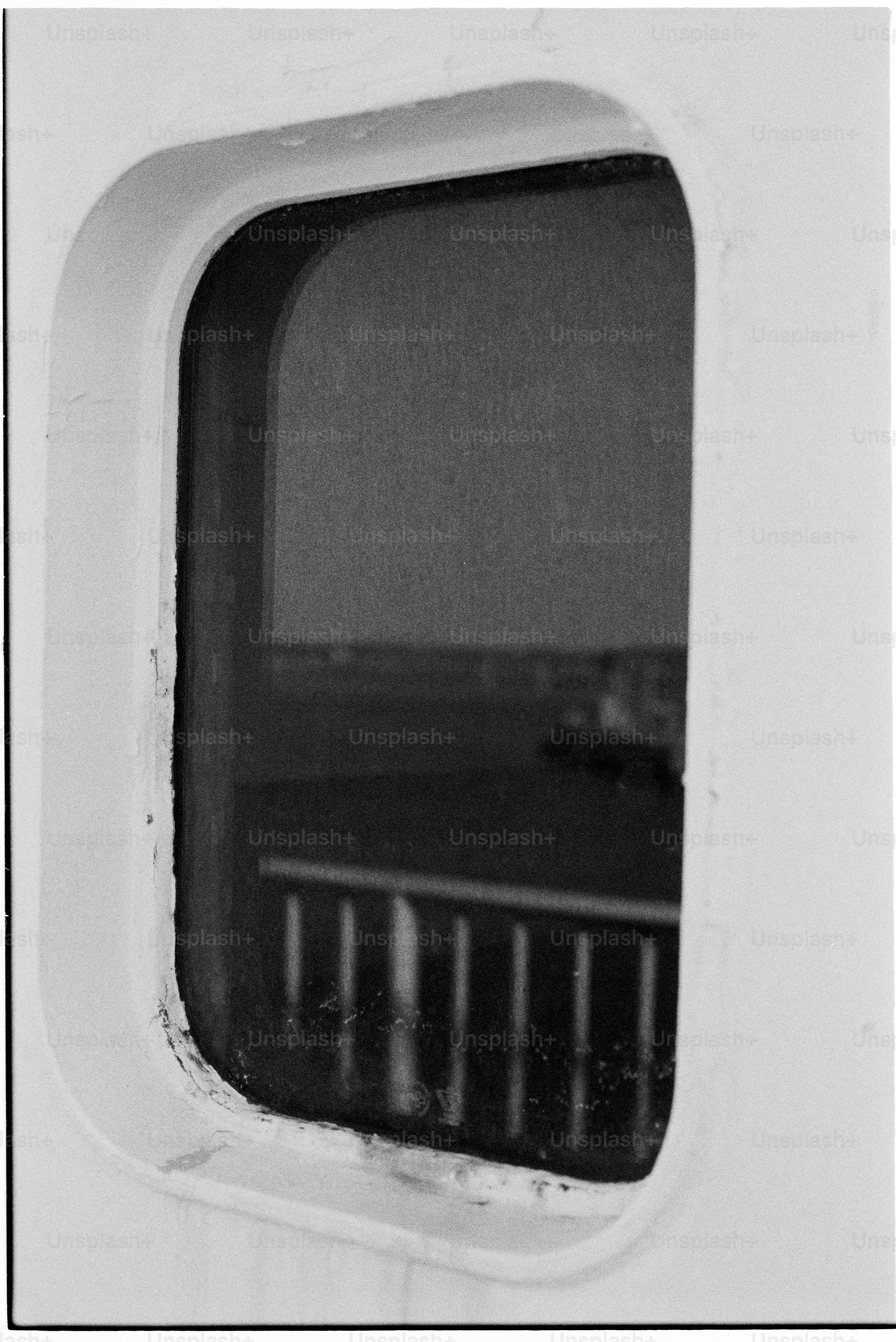Ship's porthole with dark interior view