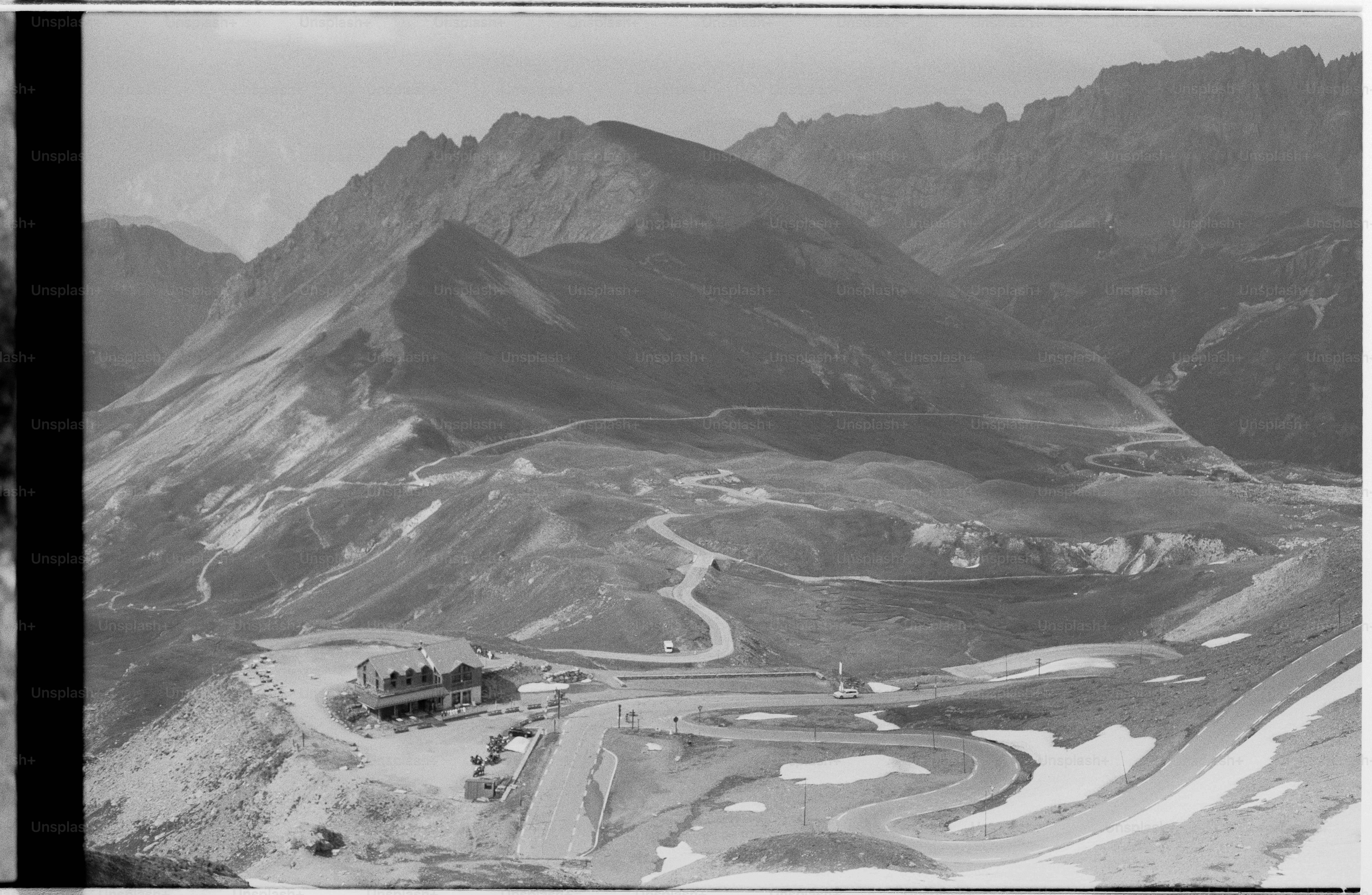 Alpine landscape with building and winding roads