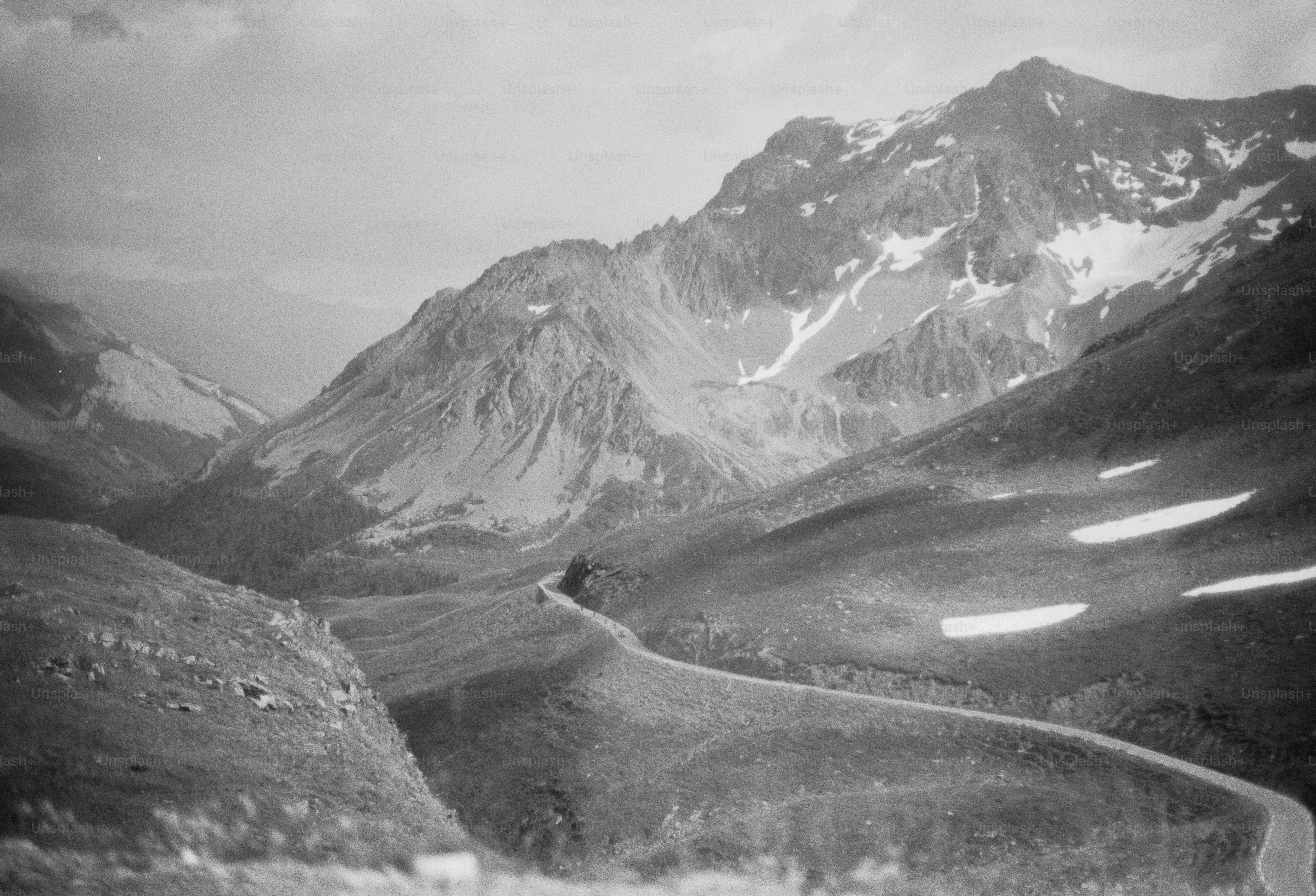 Winding road through a snowy mountain landscape