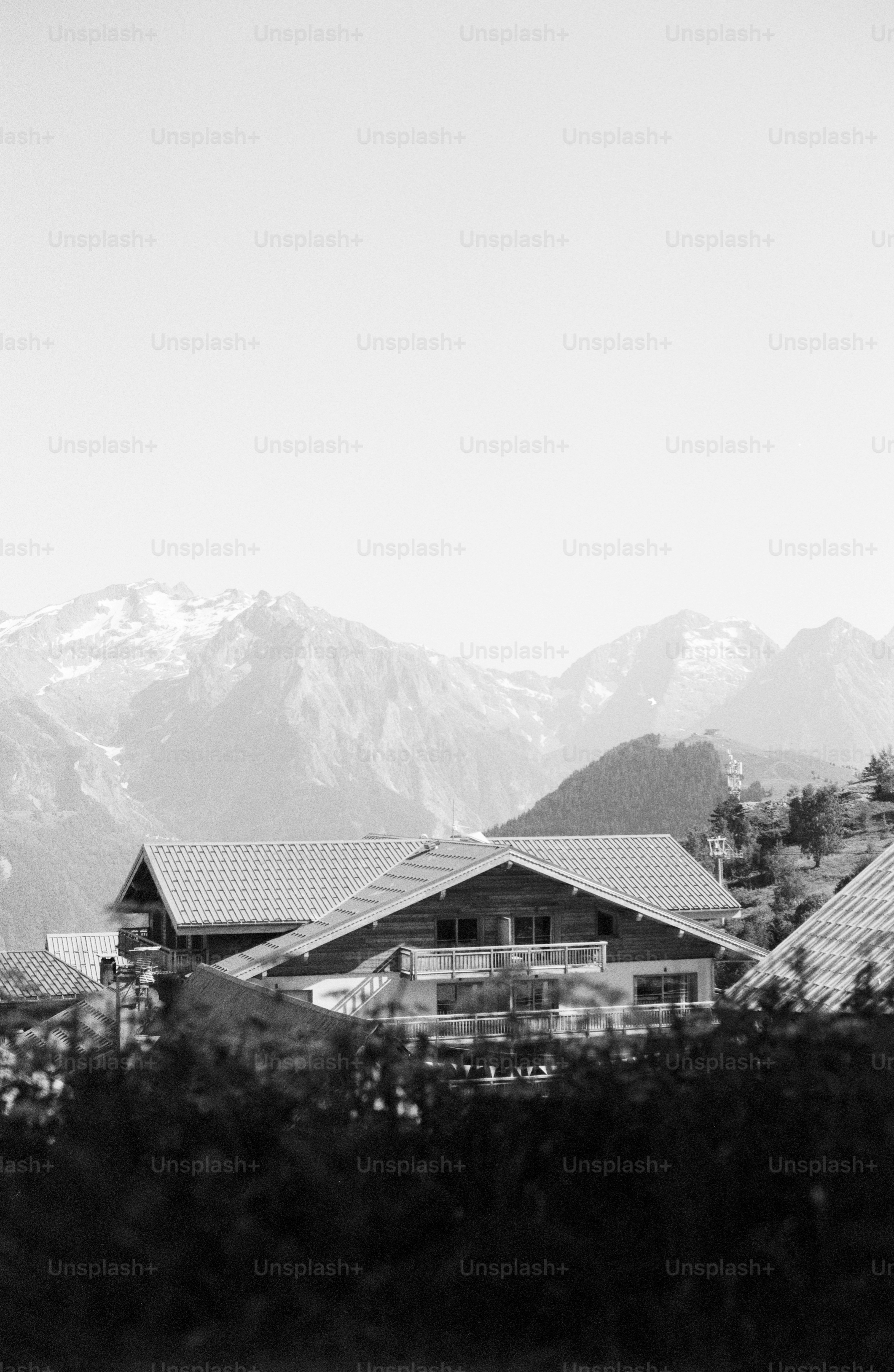 Alpine houses with towering mountains