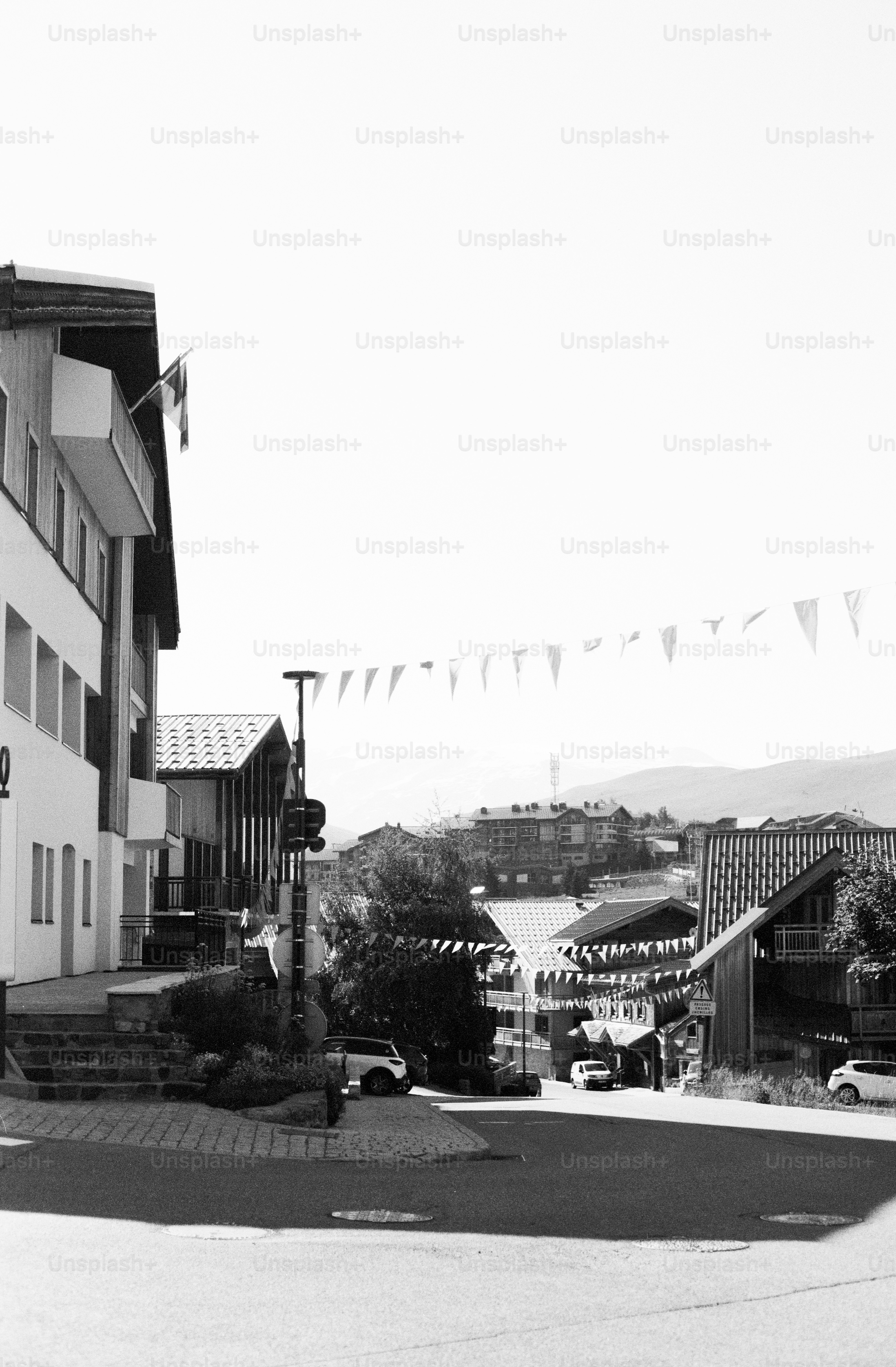 Hilly town street with buildings and bunting