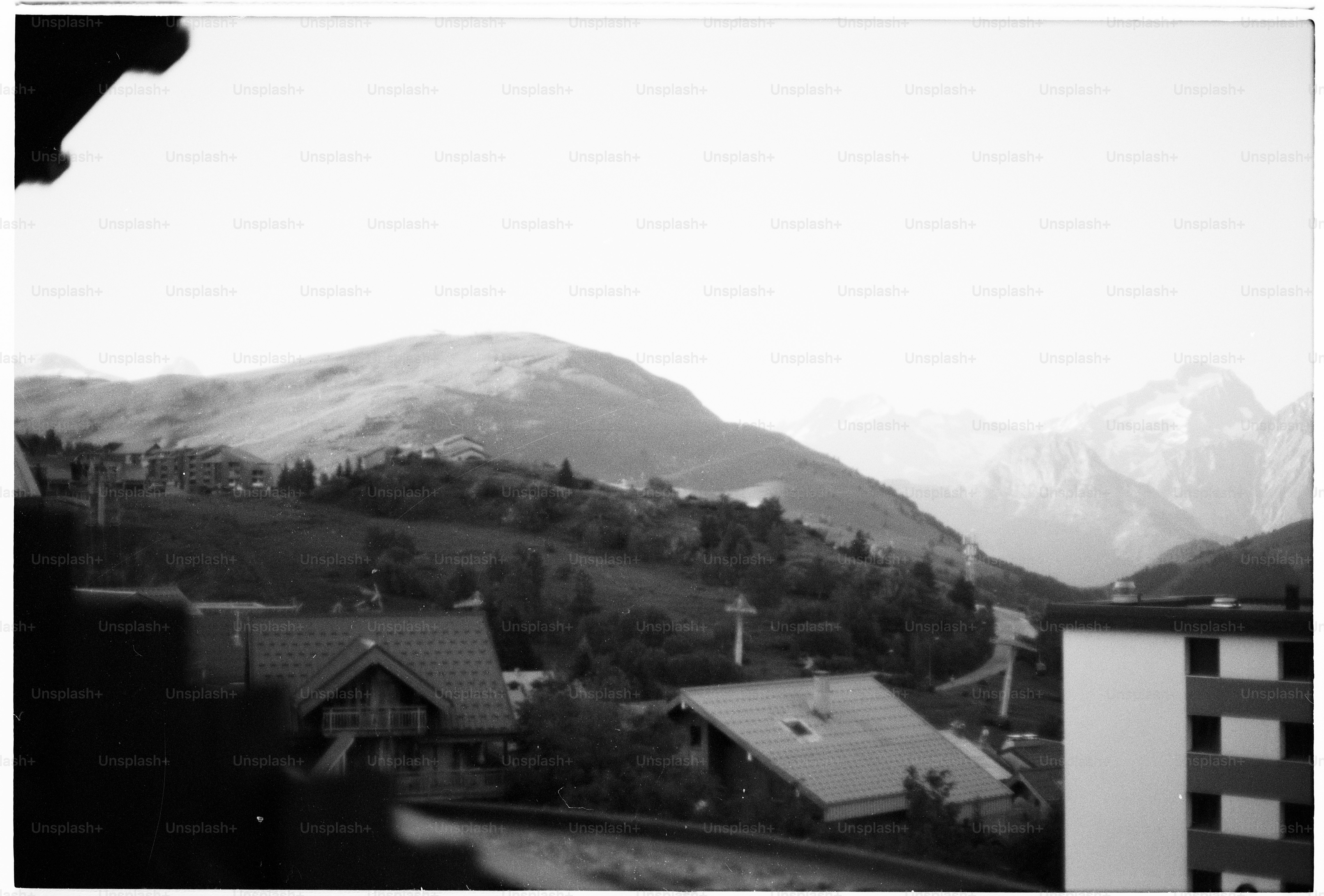 Mountain village with scattered houses in black and white