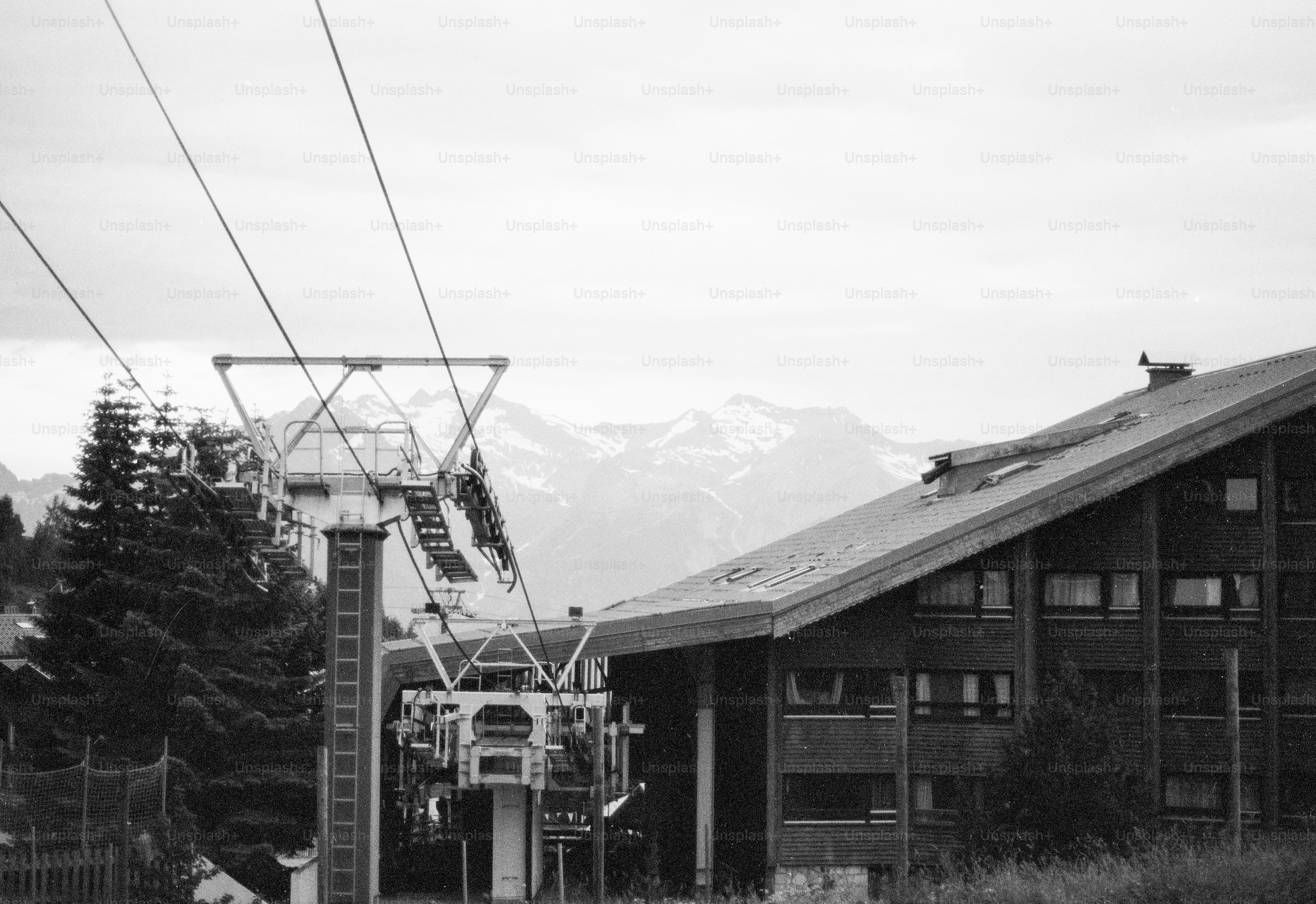 Black and white ski lift station and mountain lodge
